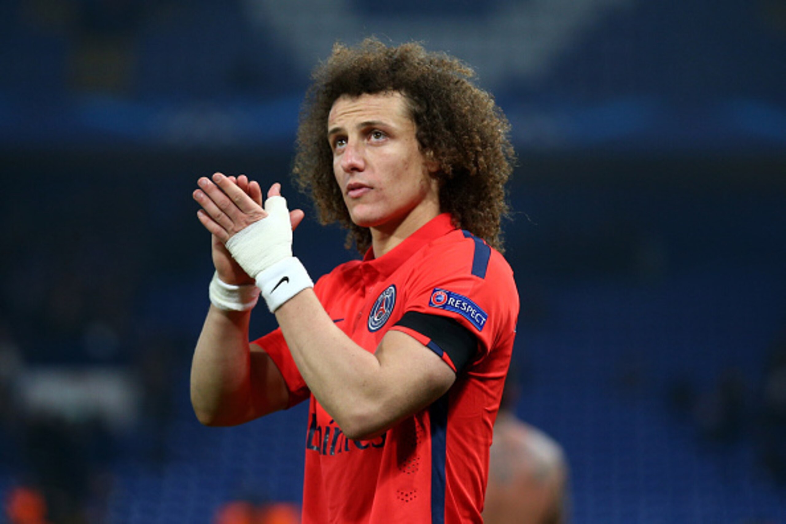 LONDON, ENGLAND - MARCH 11: David Luiz of PSG applauds the fans following his teams victory following extra time during the UEFA Champions League Round of 16, second leg match between Chelsea and Paris Saint-Germain at Stamford Bridge on March 11, 2015 in