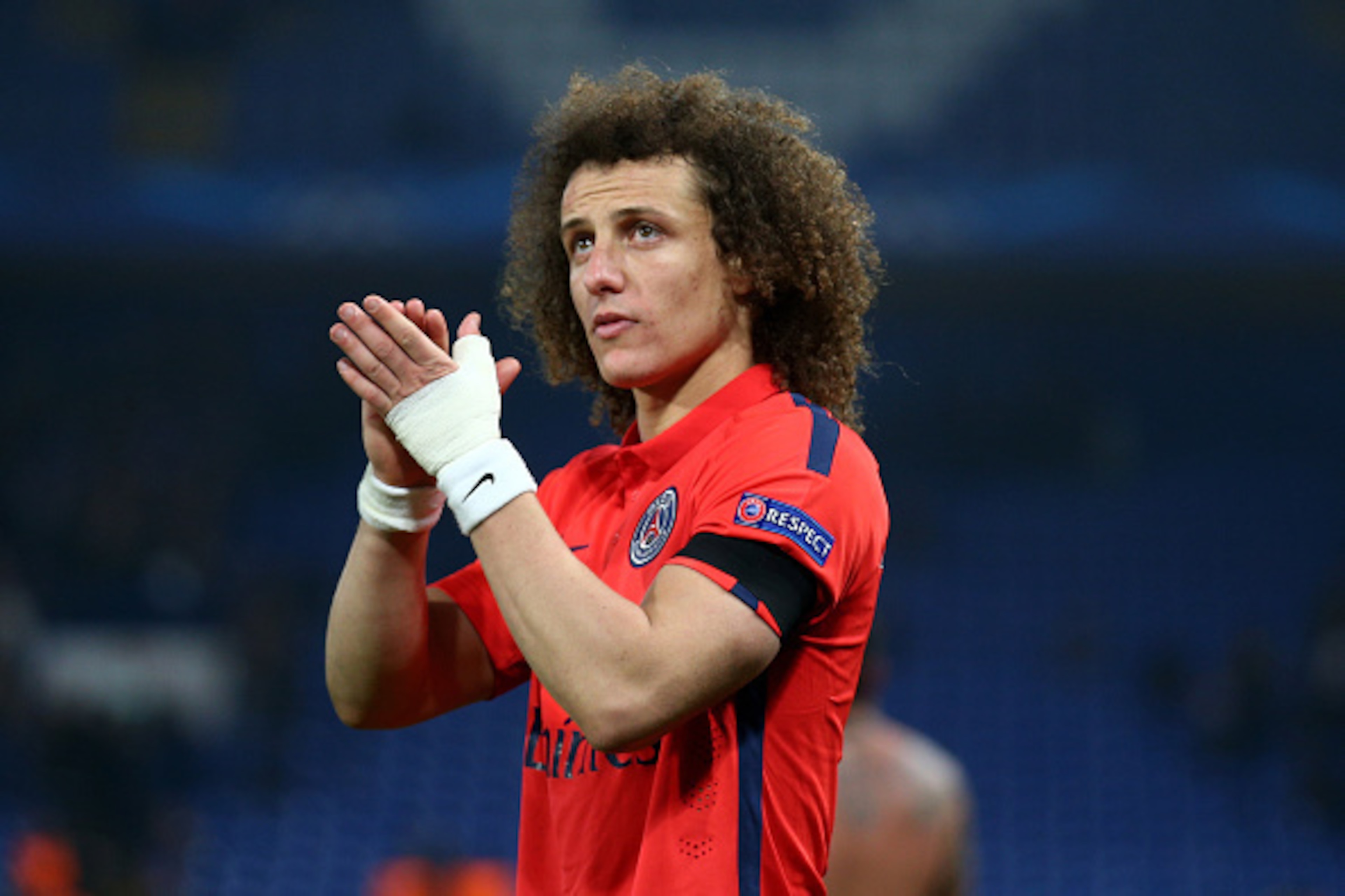 LONDON, ENGLAND - MARCH 11: David Luiz of PSG applauds the fans following his teams victory following extra time during the UEFA Champions League Round of 16, second leg match between Chelsea and Paris Saint-Germain at Stamford Bridge on March 11, 2015 in LONDON, ENGLAND - MARCH 11: David Luiz of PSG applauds the fans following his teams victory following extra time during the UEFA Champions League Round of 16, second leg match between Chelsea and Paris Saint-Germain at Stamford Bridge on March 11, 2015 in