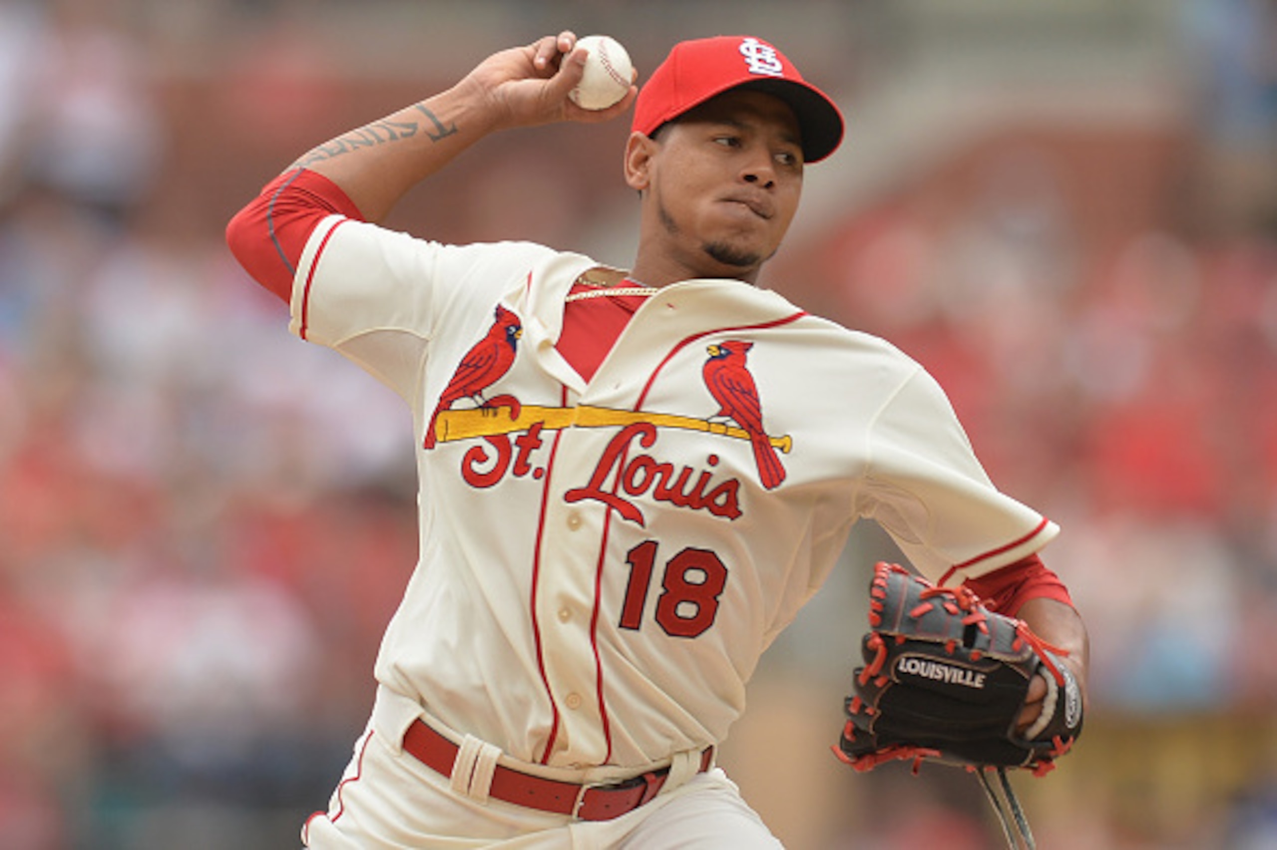 ST. LOUIS, MO - APRIL 18: Carlos Martinez #18 of the St. Louis Cardinals pitches against the Cincinnati Reds in the first inning at Busch Stadium on April 18, 2015 in St. Louis, Missouri.  (Photo by Michael Thomas/Getty Images)