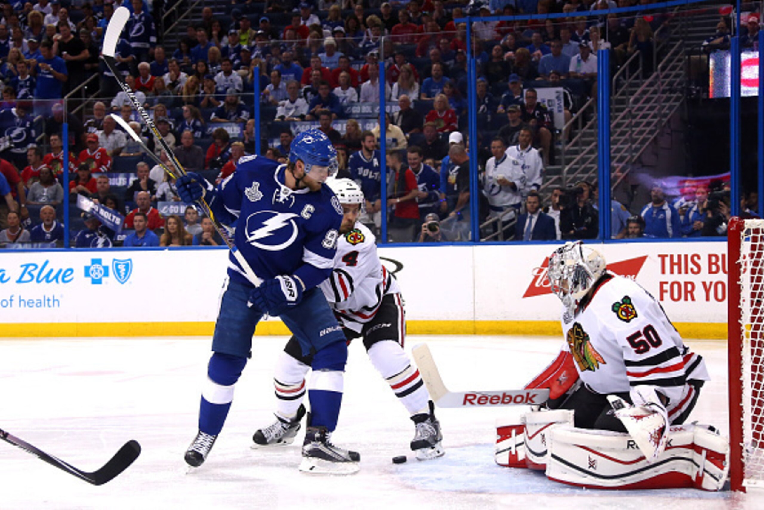 TAMPA, FL - JUNE 03:  Corey Crawford #50 of the Chicago Blackhawks in action against Steven Stamkos #91 of the Tampa Bay Lightning  during Game One of the 2015 NHL Stanley Cup Final at Amalie Arena on June 3, 2015 in Tampa, Florida.  (Photo by Bruce Benne