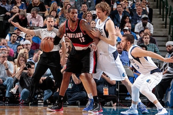 DALLAS, TX - APRIL 15: LaMarcus Aldridge #12 of the Portland Trail Blazers posts up against Dirk Nowitzki #41 of the Dallas Mavericks on April 15, 2015 at the American Airlines Center in Dallas, Texas. NOTE TO USER: User expressly acknowledges and agrees 