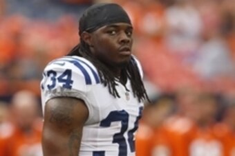 Sep 7, 2014; Denver, CO, USA; Indianapolis Colts running back Trent Richardson (34) before the game against the Denver Broncos at Sports Authority Field at Mile High. Mandatory Credit: Chris Humphreys-USA TODAY Sports