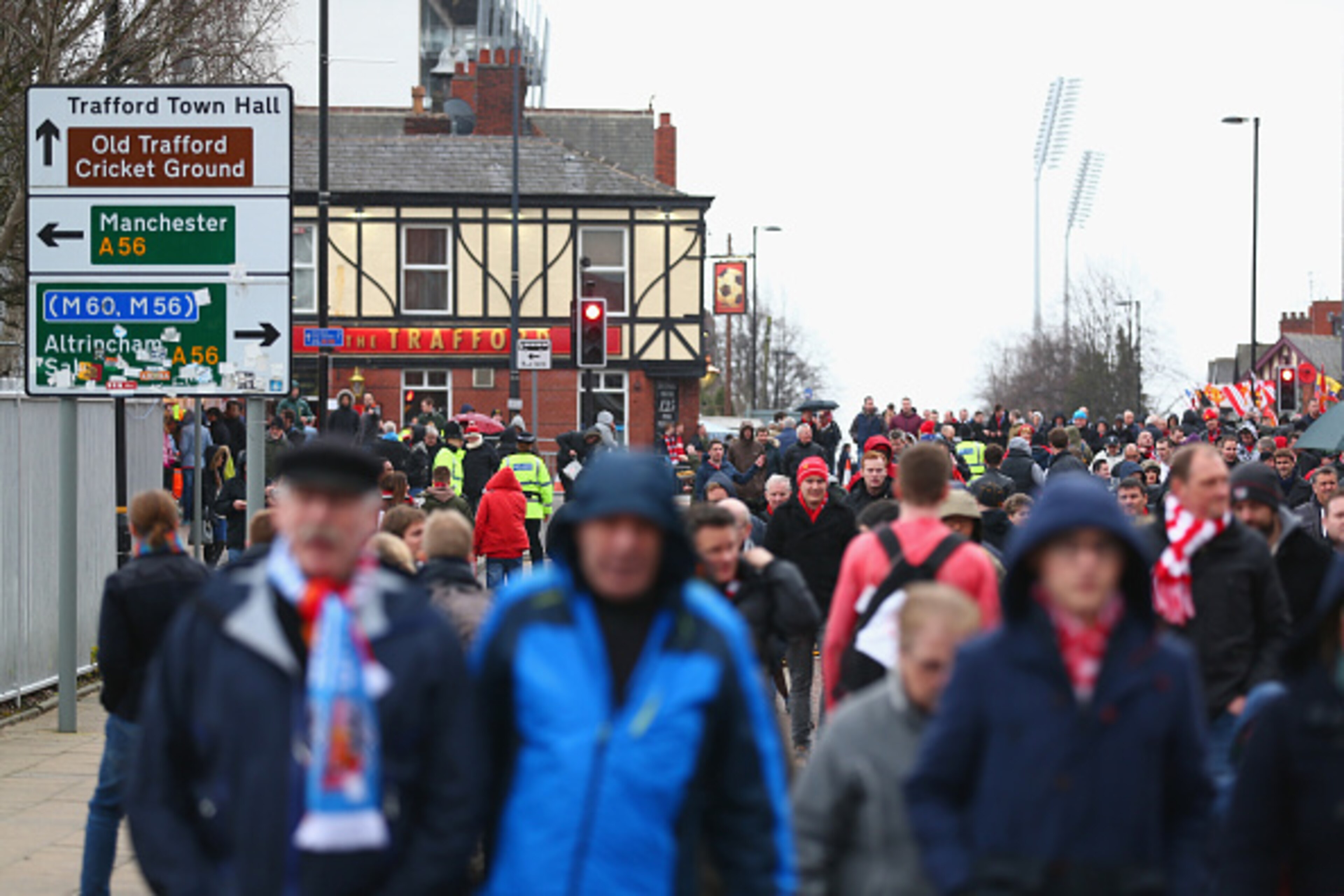 MANCHESTER, ENGLAND - FEBRUARY 28:  Fans make their way to the stadium prior to the Barclays Premier League match between Manchester United and Sunderland at Old Trafford on February 28, 2015 in Manchester, England.  (Photo by Clive Brunskill/Getty Images