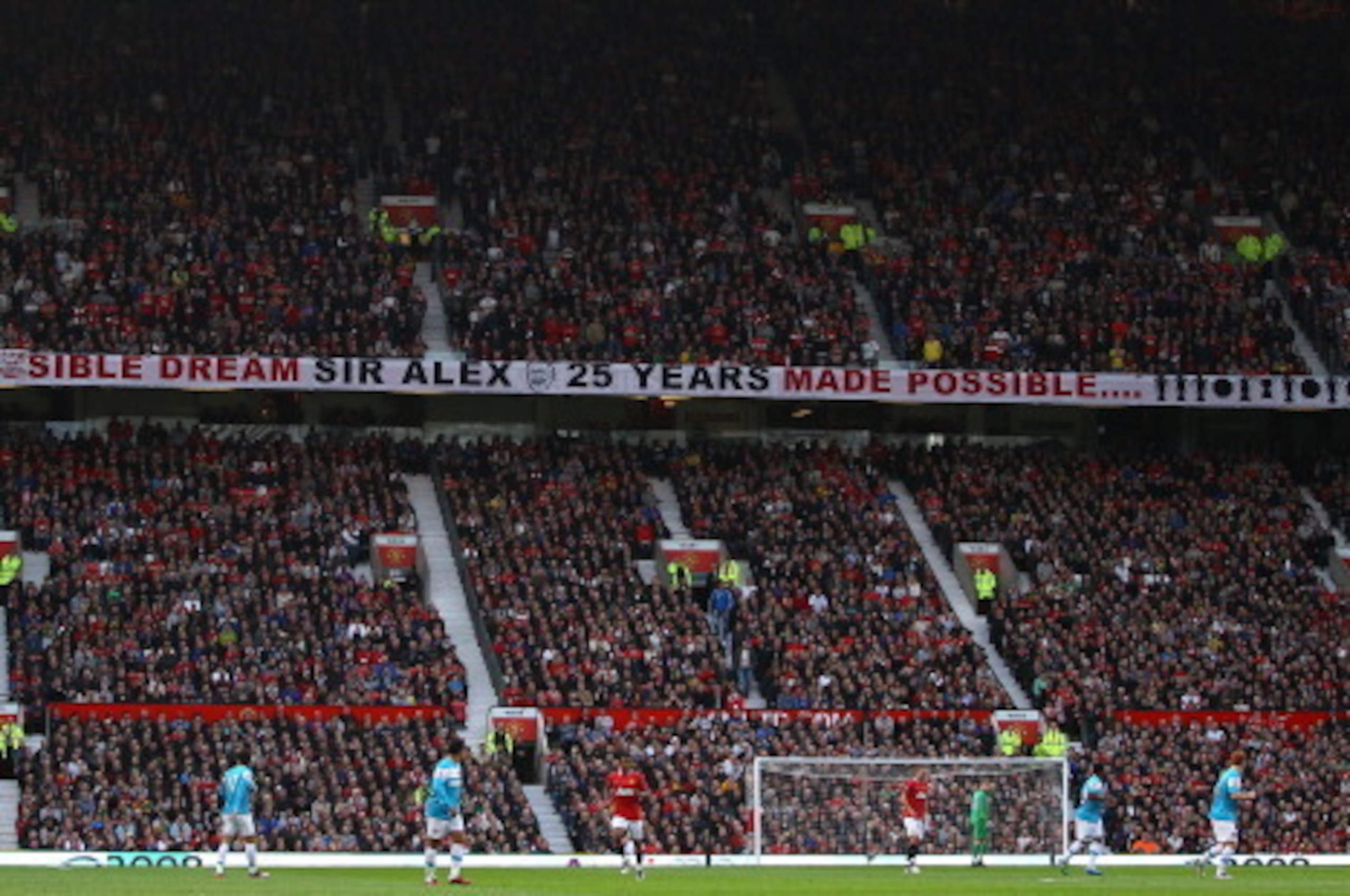 MANCHESTER, ENGLAND - NOVEMBER 05:  A banner in the Stretford End commemerating Sir Alex's 25th year as manager during the Barclays Premier League match between Manchester United and Sunderland at Old Trafford on November 5, 2011 in Manchester, England.  