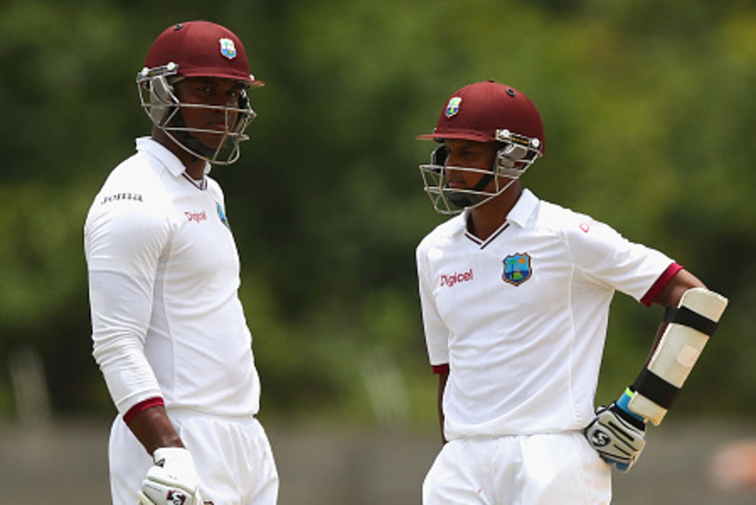 ROSEAU, DOMINICA - JUNE 05:  Marlon Samuels and Shane Dowrich of West Indies look on during day three of the First Test match between Australia and the West Indies at Windsor Park on June 5, 2015 in Roseau, Dominica.  (Photo by Ryan Pierse/Getty Images)