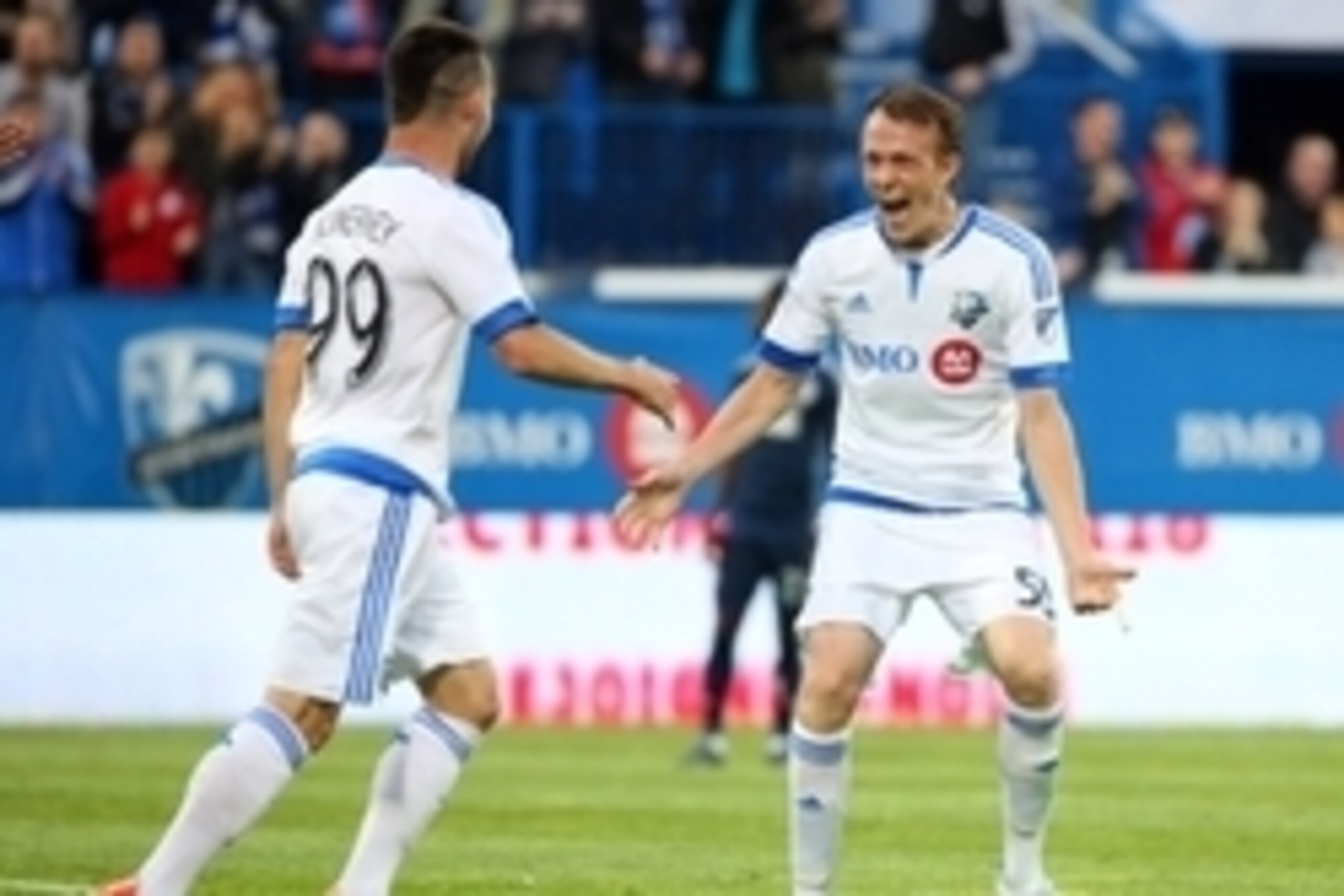Jun 3, 2015; Montreal, Quebec, CAN; Montreal Impact forward Jack McInerney (99) celebrates his goal against Vancouver FC with teammate defender Wandrille Lefevre (55) during the first half at Stade Saputo. Mandatory Credit: Jean-Yves Ahern-USA TODAY Sport Jun 3, 2015; Montreal, Quebec, CAN; Montreal Impact forward Jack McInerney (99) celebrates his goal against Vancouver FC with teammate defender Wandrille Lefevre (55) during the first half at Stade Saputo. Mandatory Credit: Jean-Yves Ahern-USA TODAY Sport