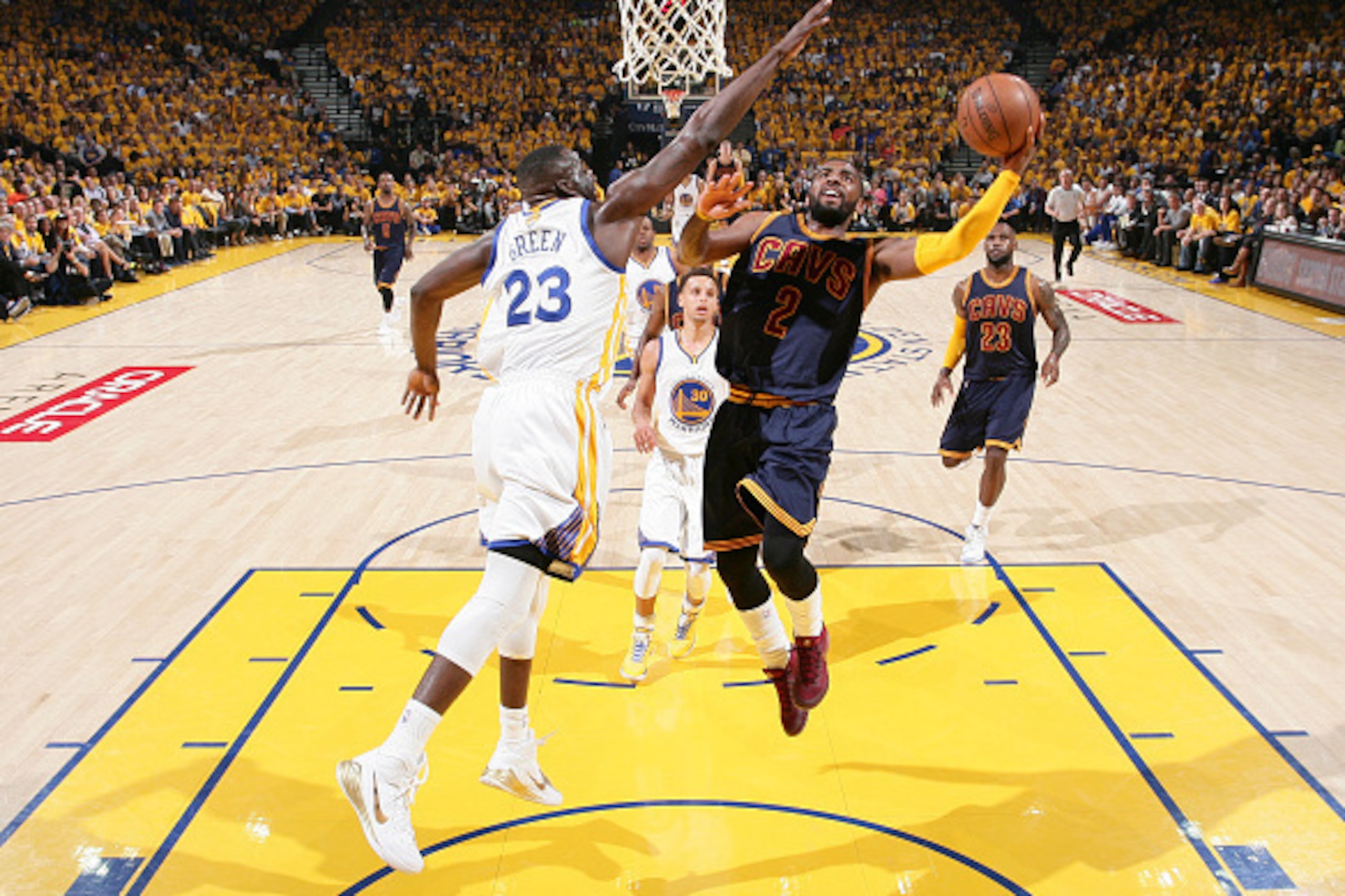 OAKLAND, CA - JUNE 4: Kyrie Irving #2 of the Cleveland Cavaliers goes up to shoot against Draymond Green #23 of the Golden State Warriors during Game One of the 2015 NBA Finals on June 4, 2015 at Oracle Arena in Oakland, California. NOTE TO USER: User exp