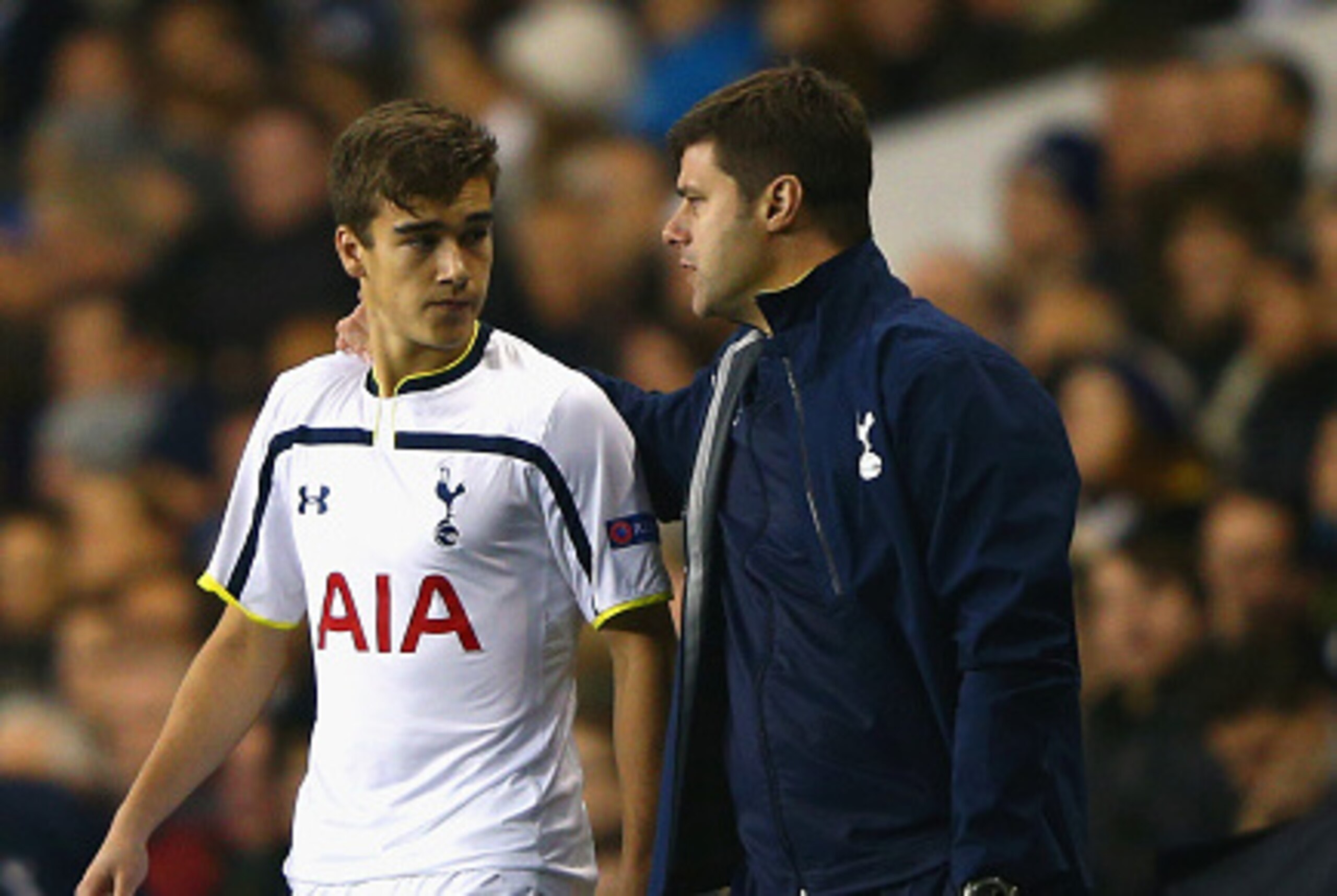 LONDON, ENGLAND - NOVEMBER 27:  Manager Mauricio Pochettino of Spurs speaks to Harry Winks of Spurs as he prepares to come on as a substitute during the UEFA Europa League group C match between Tottenham Hotspur FC and FK Partizan at White Hart Lane on No