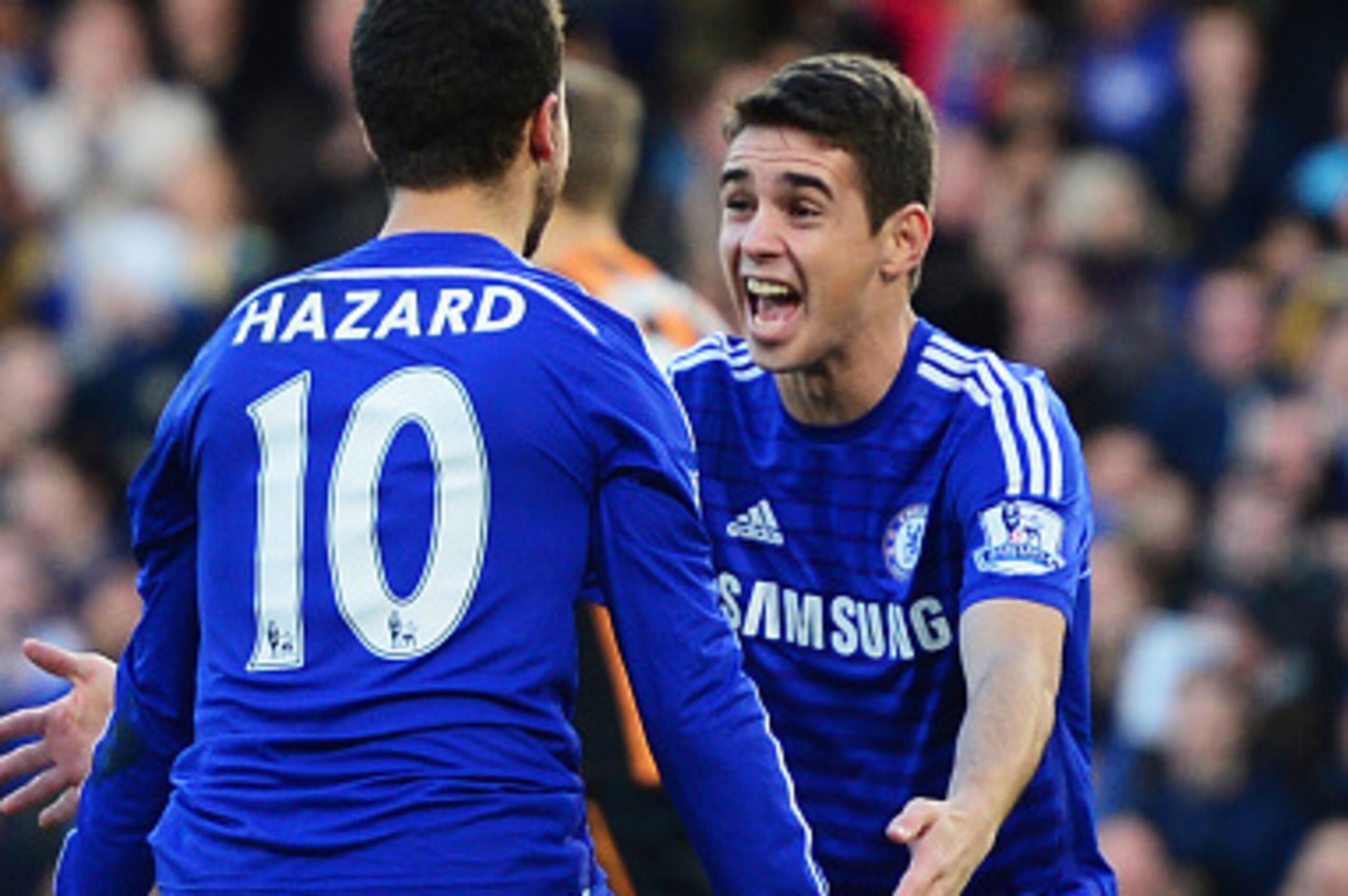 LONDON, ENGLAND - DECEMBER 13:  Eden Hazard of Chelsea (10) celebrates with Oscar as he scores their first goal  during the Barclays Premier League match between Chelsea and Hull City at Stamford Bridge on December 13, 2014 in London, England.  (Photo by 