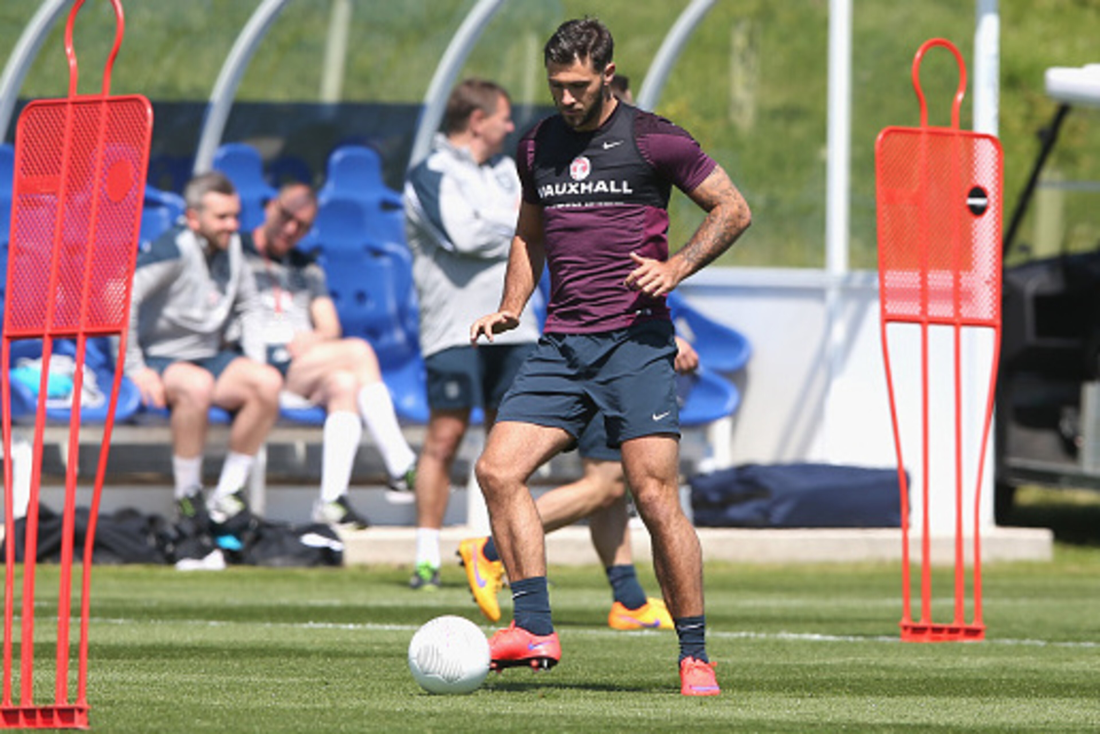 BURTON-UPON-TRENT, ENGLAND - JUNE 04:  Charlie Austin runs with the ball during the England training session held at St Georges Park on June 4, 2015 in Burton-upon-Trent, England.  (Photo by David Rogers/Getty Images)