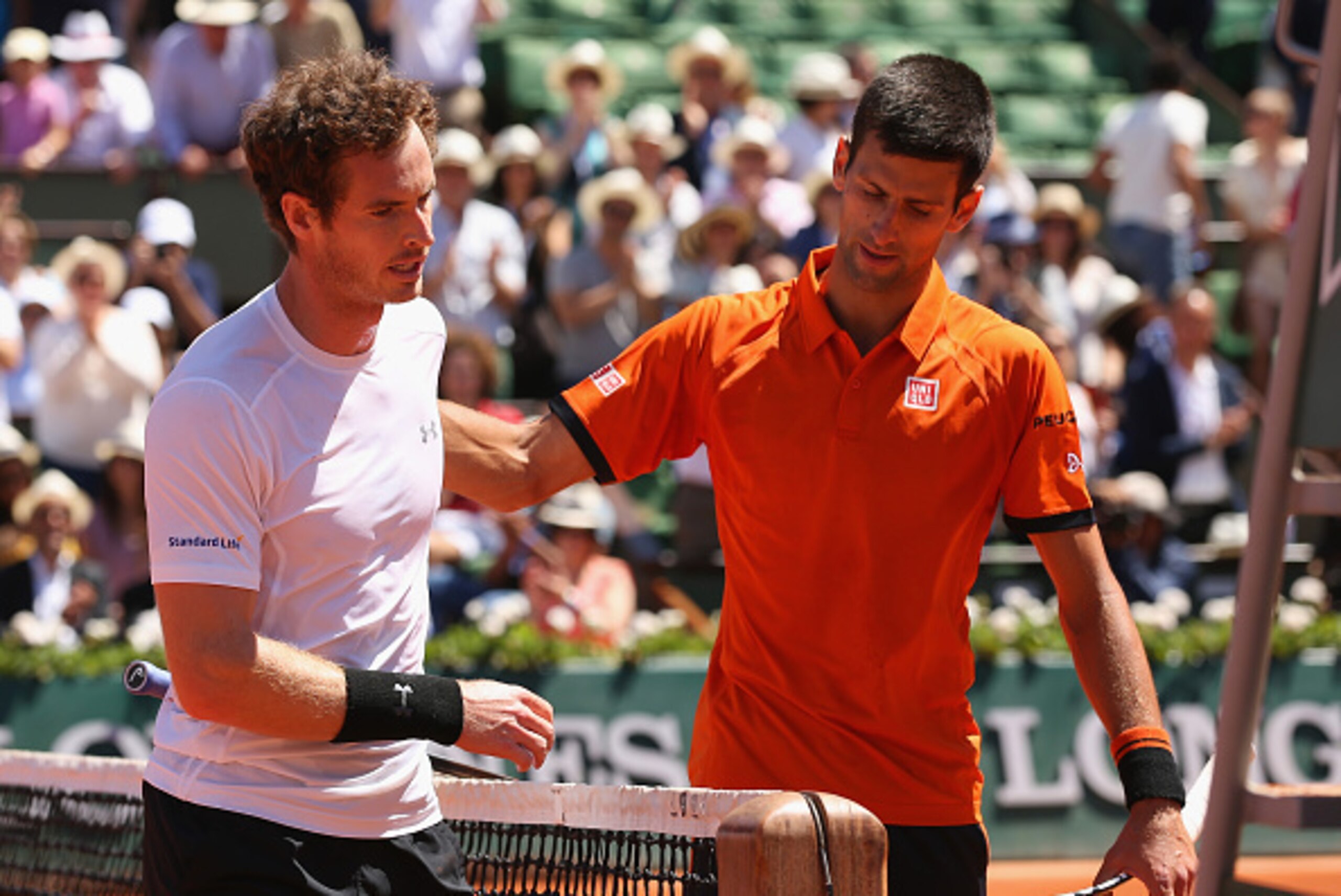 PARIS, FRANCE - JUNE 06:  Andy Murray of Great Britain (L) congratulates Novak Djokovic of Serbia after defeat in their Men's Semi Final match on day fourteen of the 2015 French Open at Roland Garros on June 6, 2015 in Paris, France.  (Photo by Clive Brun