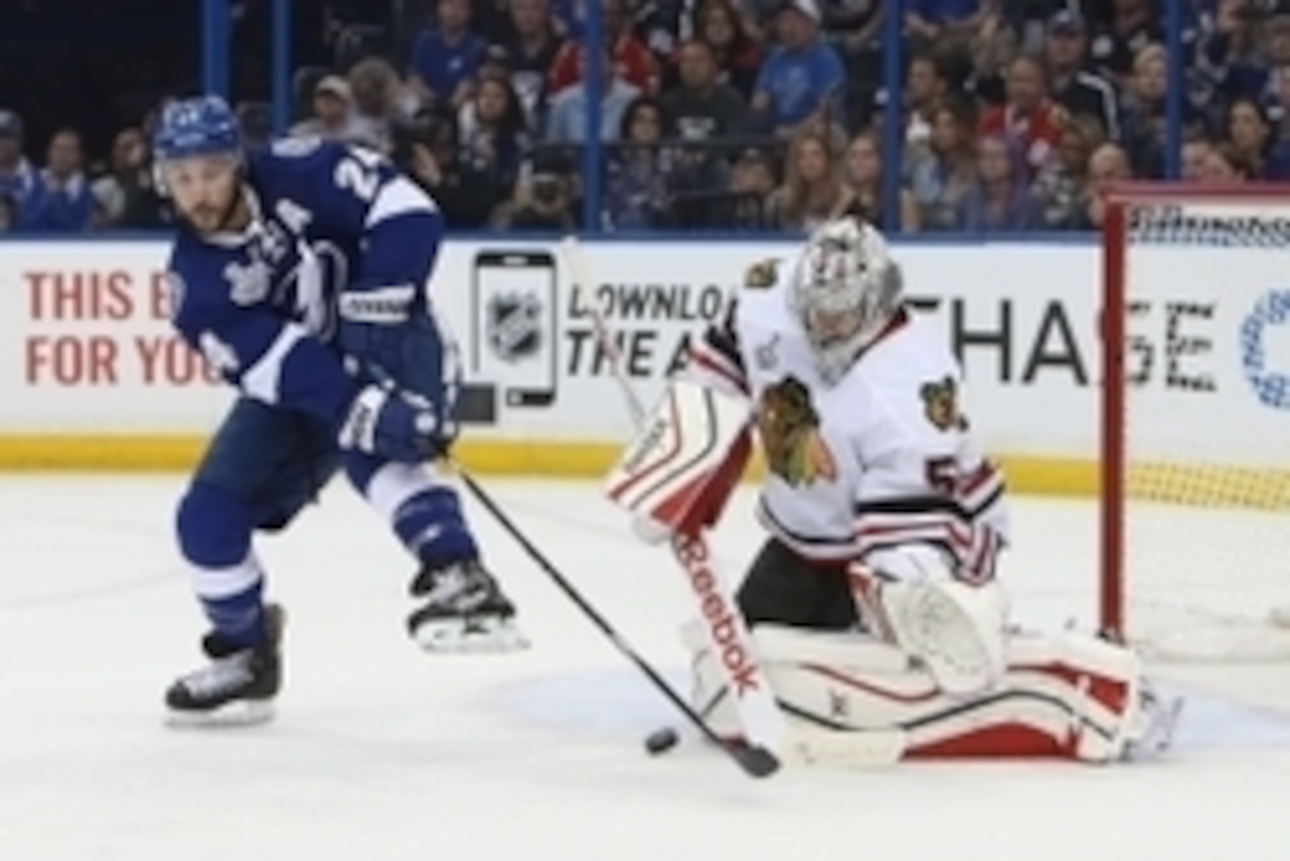 Jun 3, 2015; Tampa, FL, USA; Chicago Blackhawks goalie Corey Crawford (50) makes a save against Tampa Bay Lightning right wing Ryan Callahan (24)  in the second period in game one of the 2015 Stanley Cup Final at Amalie Arena. Mandatory Credit: Kim Klemen