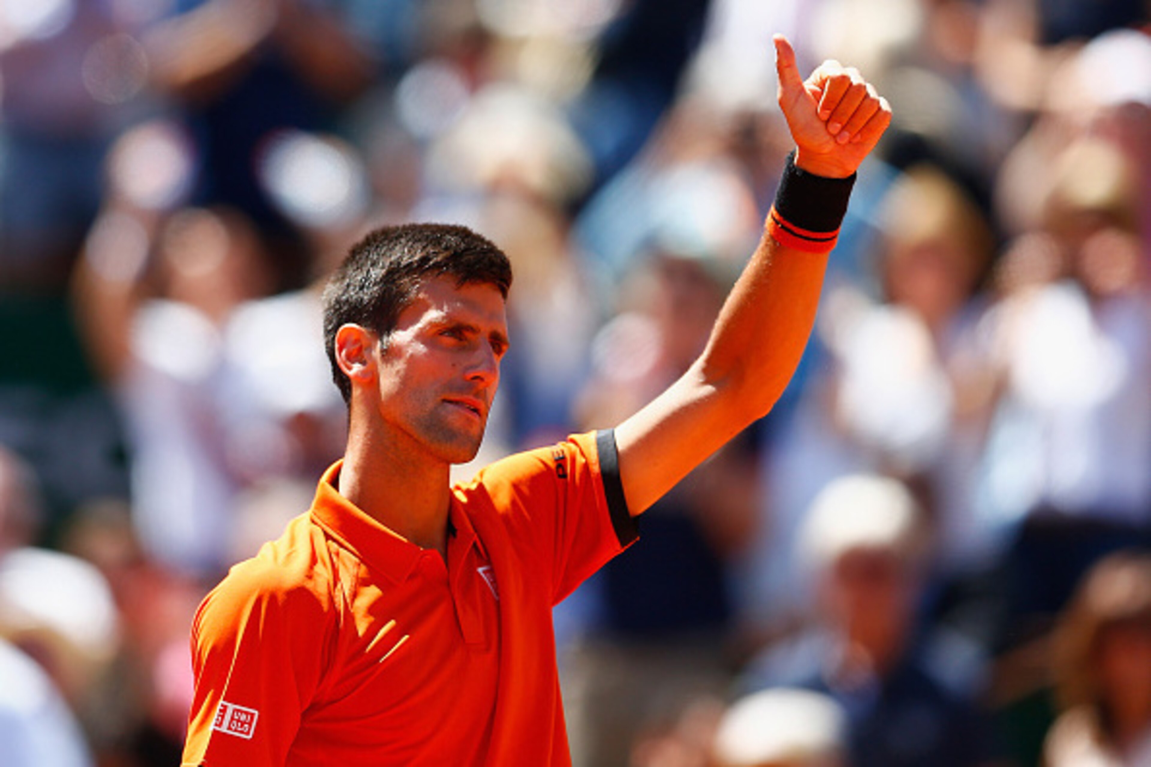 PARIS, FRANCE - JUNE 06:  Novak Djokovic of Serbia celebrates winning the Men's Semi Final match against Andy Murray of Great Britain on day fourteen of the 2015 French Open at Roland Garros on June 6, 2015 in Paris, France.  (Photo by Julian Finney/Getty