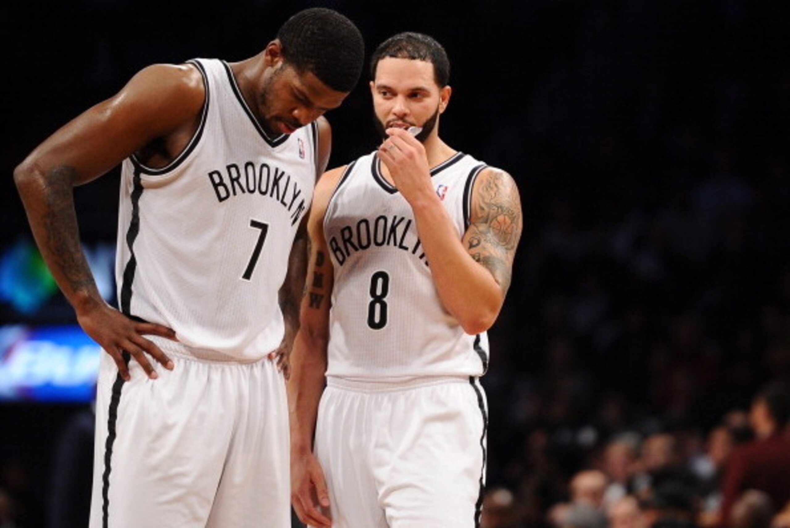 NEW YORK, NY - DECEMBER 18:  Joe Johnson #7 and Deron Williams #8 of the Brooklyn Nets talk during the second half against the Washington Wizards at Barclays Center on December 18, 2013 in the Brooklyn borough of New York City. The Wizards defeat the Nets