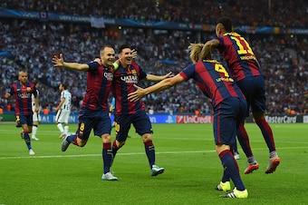 BERLIN, GERMANY - JUNE 06:  Andres Iniesta and Lionel Messi of Barcelona congratulate Ivan Rakitic after his opening goal during the UEFA Champions League Final between Juventus and FC Barcelona at Olympiastadion on June 6, 2015 in Berlin, Germany.  (Phot