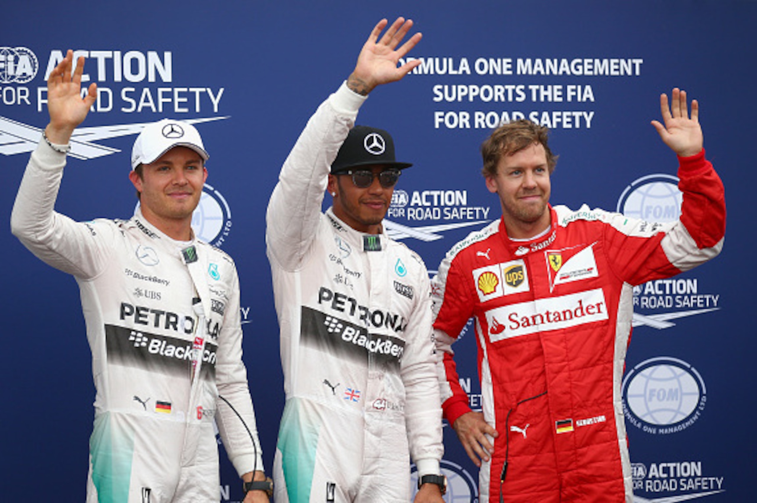 MONTE-CARLO, MONACO - MAY 23:  Lewis Hamilton (C) of Great Britain and Mercedes GP celebrates finishing first alongside second placed Nico Rosberg (L) of Germany and Mercedes GP and thrid placed Sebastian Vettel (R) of Germany and Ferrari following qualif
