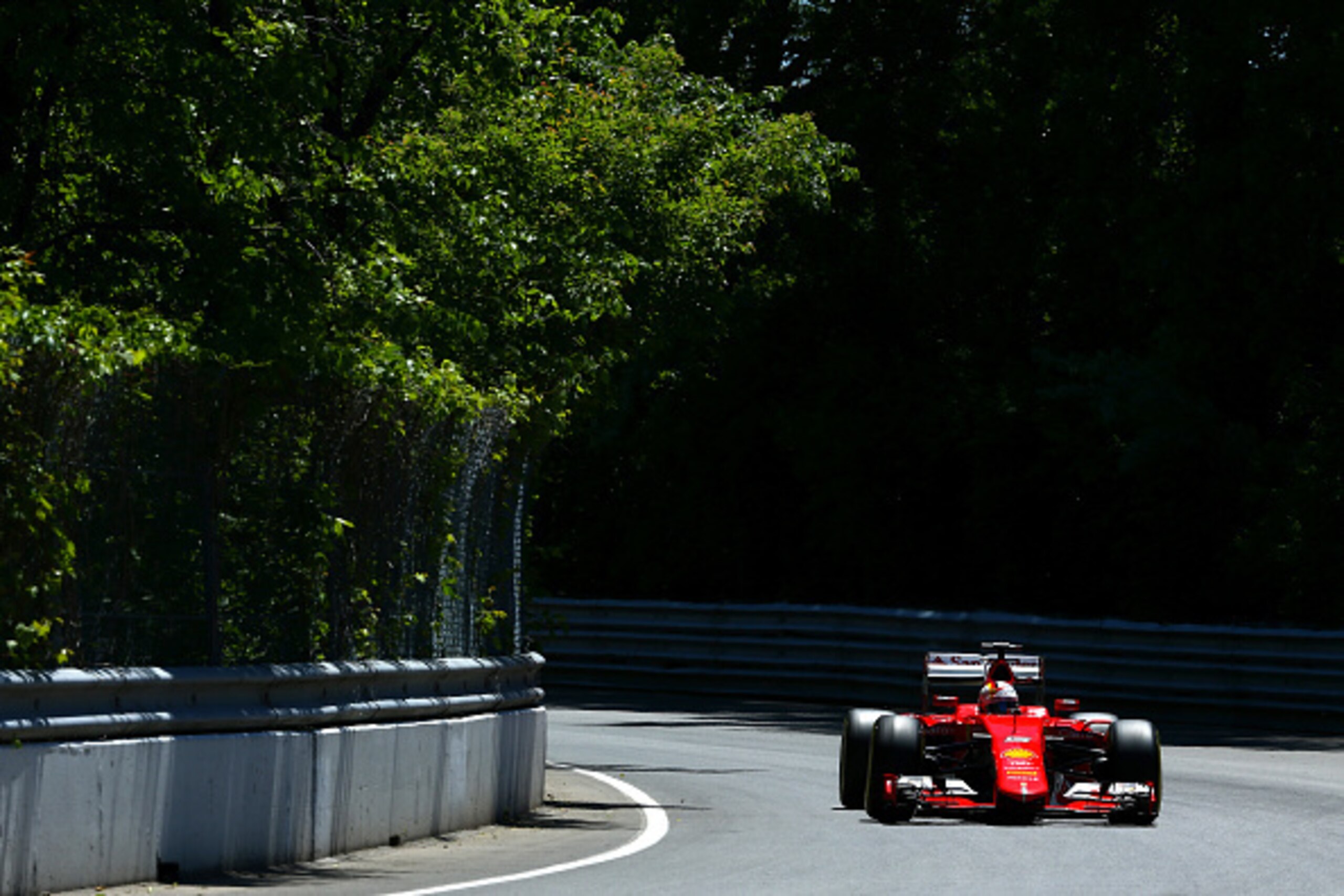 MONTREAL, QC - JUNE 06:  Sebastian Vettel of Germany and Ferrari drives during qualifying for the Canadian Formula One Grand Prix at Circuit Gilles Villeneuve on June 6, 2015 in Montreal, Canada.  (Photo by Clive Mason/Getty Images)