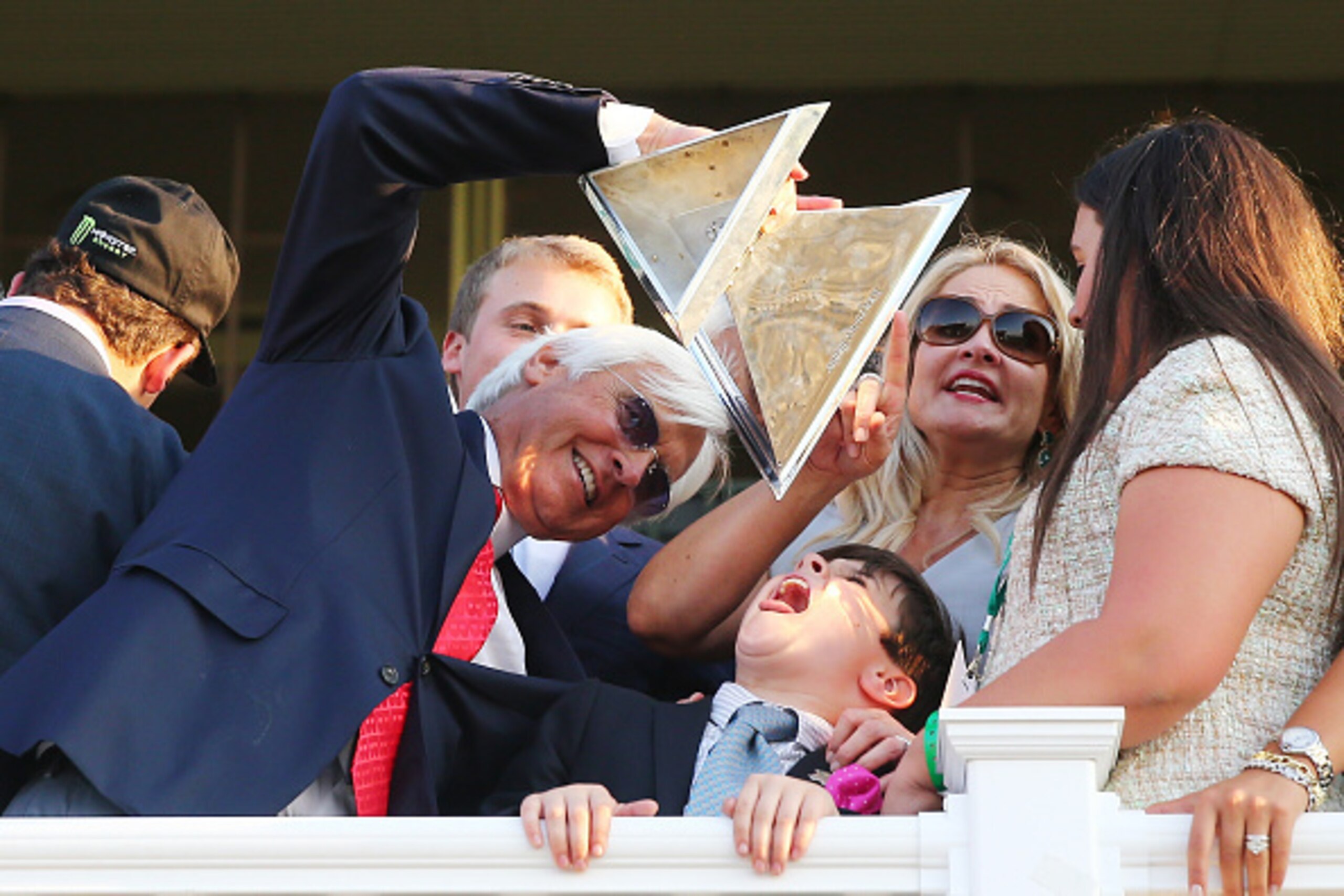 ELMONT, NY - JUNE 06:  Bob Baffert, trainer of American Pharoah #5, celebrates as his son Bode looks on after winning the 147th running of the Belmont Stakes at Belmont Park on June 6, 2015 in Elmont, New York. With the wins American Pharoah becomes the f