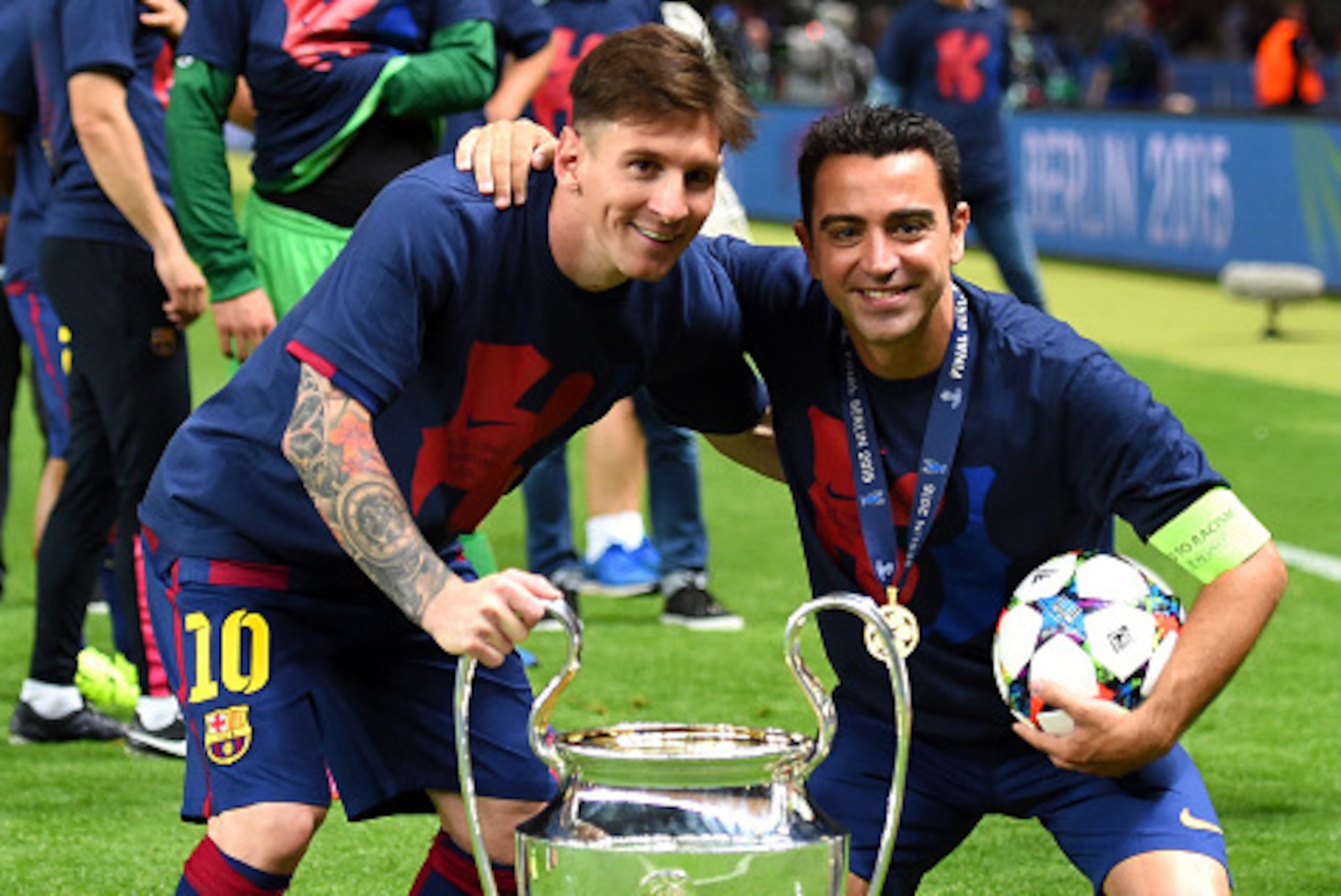 BERLIN, GERMANY - JUNE 06:  Lionel Messi and Xavi Hernandez of Barcelona celebrate with the trophy after the UEFA Champions League Final between Juventus and FC Barcelona at Olympiastadion on June 6, 2015 in Berlin, Germany.  (Photo by Shaun Botterill/Get