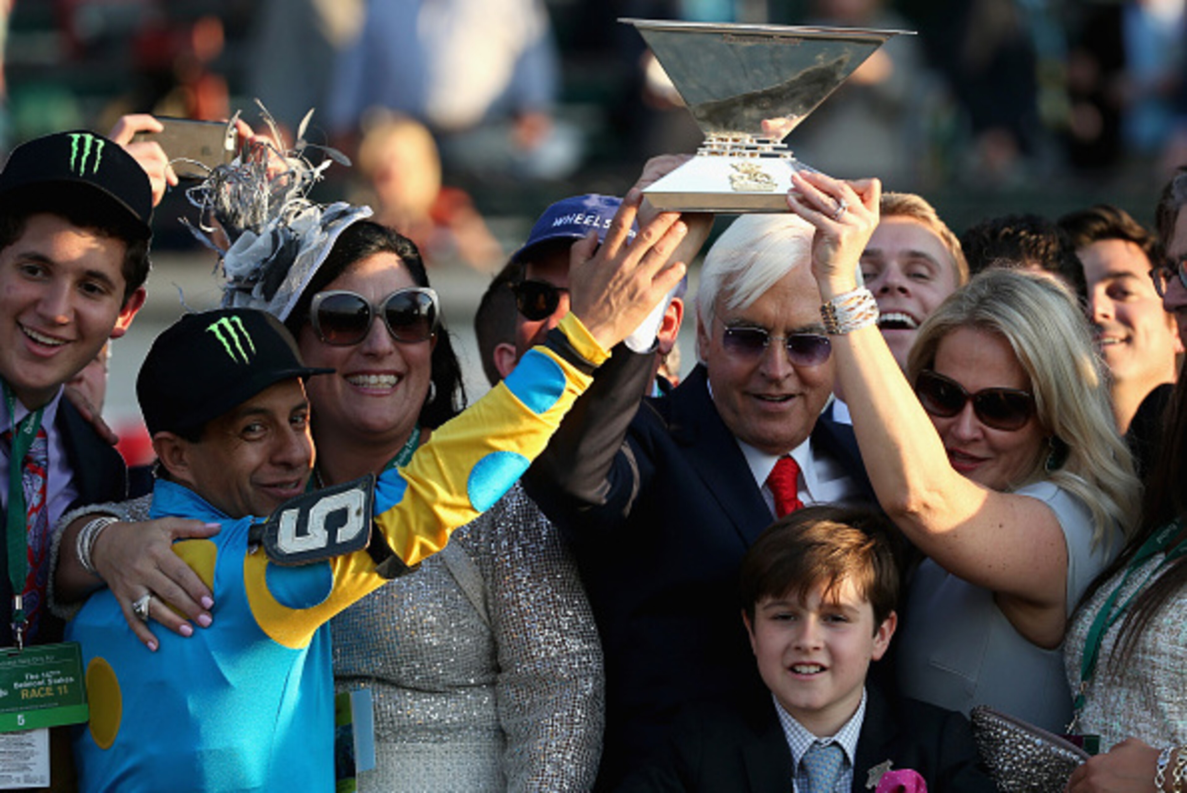 ELMONT, NY - JUNE 06: Victor Espinoza (L), jockey of American Pharaoh #5, and trainer Bob Baffert, celebrate with the Triple Crown Trophy after winning the 147th running of the Belmont Stakes at Belmont Park on June 6, 2015 in Elmont, New York. (Photo b ELMONT, NY - JUNE 06: Victor Espinoza (L), jockey of American Pharaoh #5, and trainer Bob Baffert, celebrate with the Triple Crown Trophy after winning the 147th running of the Belmont Stakes at Belmont Park on June 6, 2015 in Elmont, New York. (Photo b