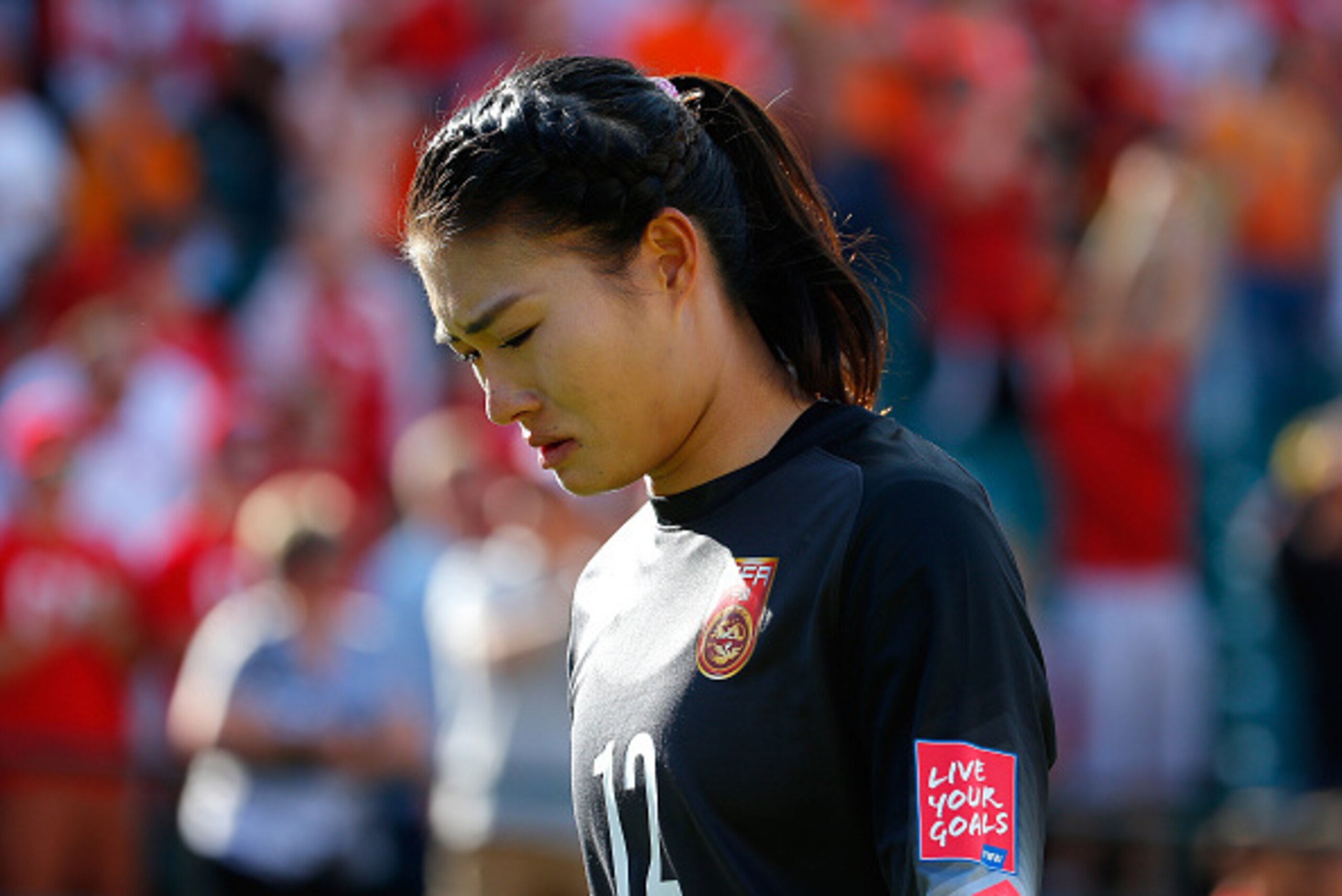 EDMONTON, AB - JUNE 06: Goalkeeper Wang Fei #12 of China PR reacts after their 1-0 loss to Canada during the FIFA Women's World Cup Canada 2015 Group A match between Canada and China PR at Commonwealth Stadium on June 6, 2015 in Edmonton, Canada.  (Photo 