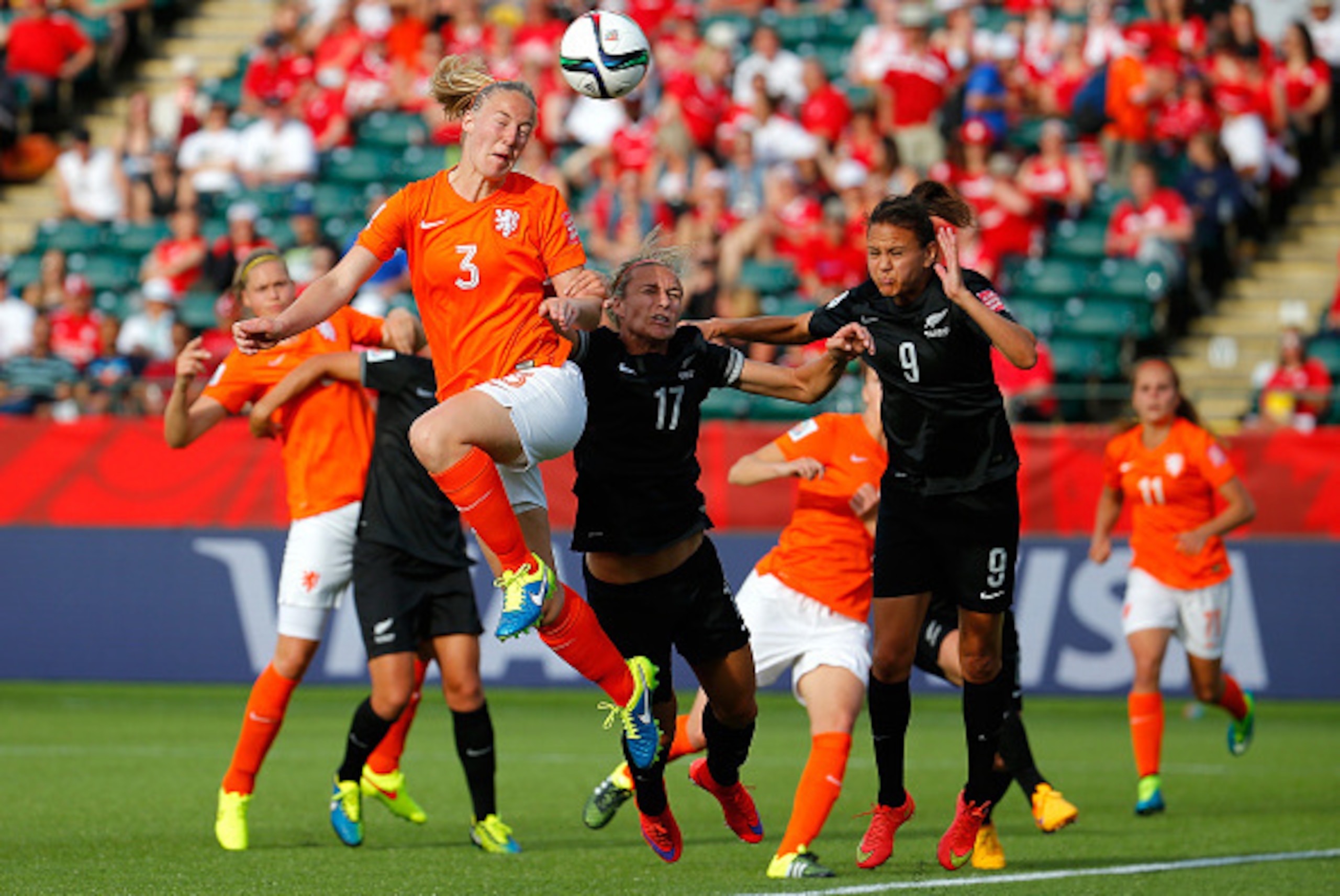 EDMONTON, AB - JUNE 06:  Stefanie Van Der Gragt #3 of Netherlands attempts a shot on goal against Hannah Wilkinson #17 and Amber Hearn #9 of New Zealand during the FIFA Women's World Cup Canada 2015 Group A match between New Zealand and the Netherlands at
