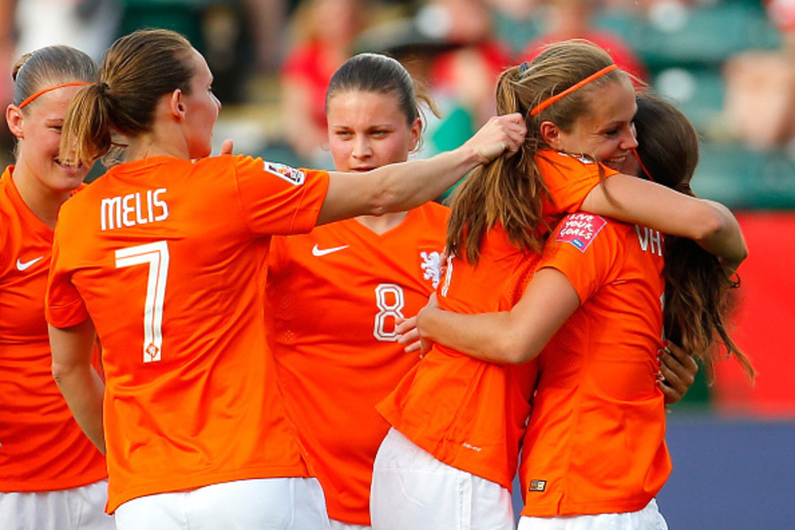 EDMONTON, AB - JUNE 06: Lieke Martens #11 of Netherlands hugs Danielle Van De Donk #10 as she celebrates her goal against New Zealand with her teammates during the FIFA Women's World Cup Canada 2015 Group A match between New Zealand and the Netherlands a EDMONTON, AB - JUNE 06: Lieke Martens #11 of Netherlands hugs Danielle Van De Donk #10 as she celebrates her goal against New Zealand with her teammates during the FIFA Women's World Cup Canada 2015 Group A match between New Zealand and the Netherlands a