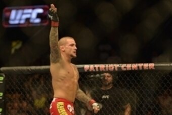 Apr 4, 2015; Fairfax, VA, USA; Dustin Poirier (red gloves) celebrates after the first round of a technical knock out against Diego Ferreira (not pictured) during UFC Fight Night at Patriot Center. Mandatory Credit: Tommy Gilligan-USA TODAY Sports