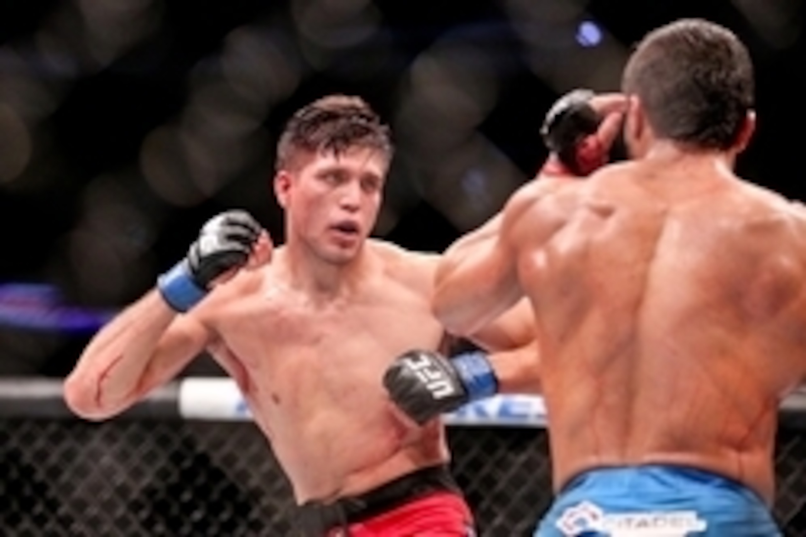 Jun 6, 2015; New Orleans, LA, USA; Thiago Tavares (blue trunks) fights Brian Ortega (red trunks) during UFC Fight Night at the Smoothie King Center. Mandatory Credit: Derick E. Hingle-USA TODAY Sports