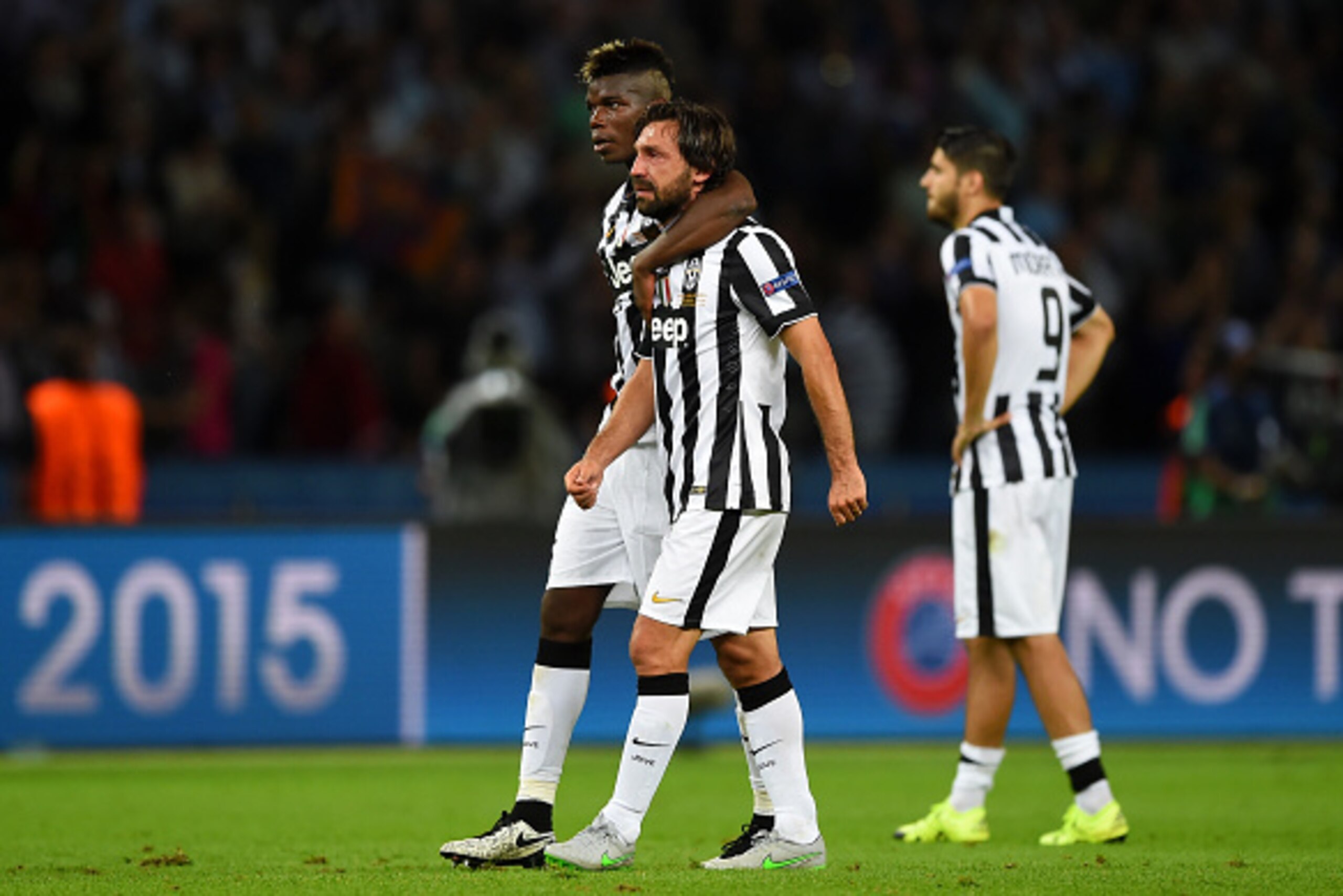 BERLIN, GERMANY - JUNE 06: Andrea Pirlo of Juventus is consoled by Paul Pogba after the UEFA Champions League Final between Juventus and FC Barcelona at Olympiastadion on June 6, 2015 in Berlin, Germany. (Photo by Shaun Botterill/Getty Images) BERLIN, GERMANY - JUNE 06: Andrea Pirlo of Juventus is consoled by Paul Pogba after the UEFA Champions League Final between Juventus and FC Barcelona at Olympiastadion on June 6, 2015 in Berlin, Germany. (Photo by Shaun Botterill/Getty Images)