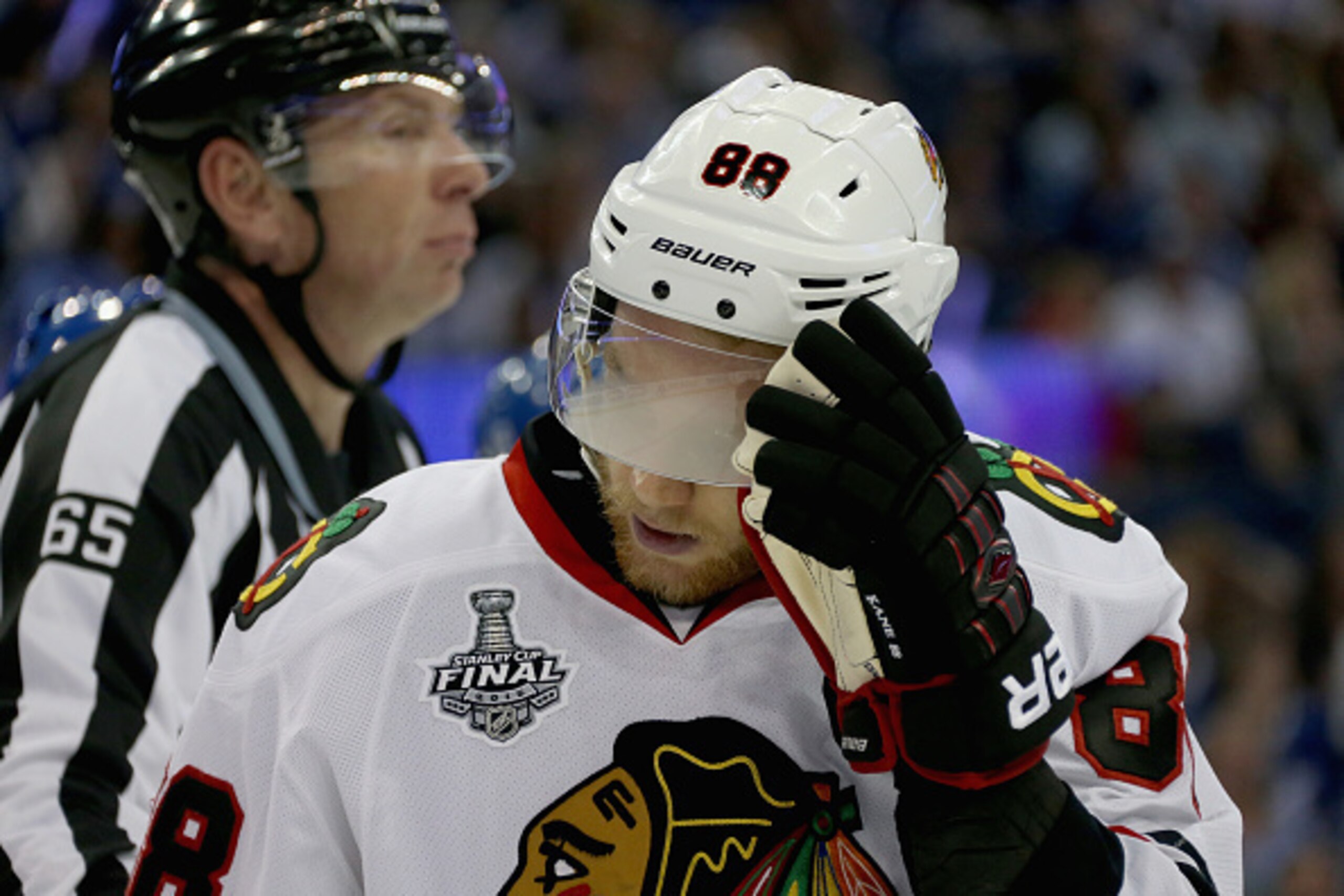 TAMPA, FL - JUNE 06:  Marian Hossa #81 of the Chicago Blackhawks adjusts his foggy visor during the third period of Game Two of the 2015 NHL Stanley Cup Final against the Tampa Bay Lightning at Amalie Arena on June 6, 2015 in Tampa, Florida.  (Photo by Da