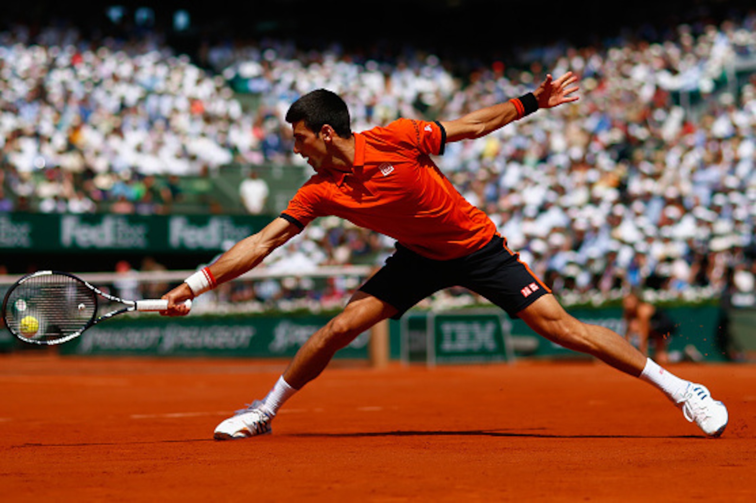 PARIS, FRANCE - JUNE 07:  Novak Djokovic of Serbia returns a shot in the Men's Singles Final against Stanislas Wawrinka of Switzerland on day fifteen of the 2015 French Open at Roland Garros on June 7, 2015 in Paris, France.  (Photo by Julian Finney/Getty