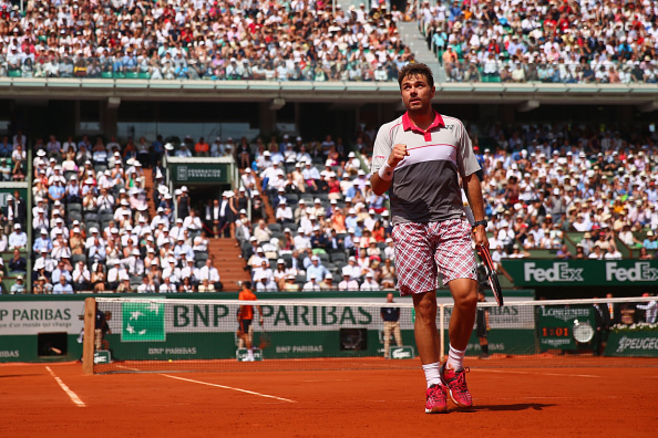 PARIS, FRANCE - JUNE 07:  Stanislas Wawrinka of Switzerland celebrates a point in the Men's Singles Final against Novak Djokovic of Serbia on day fifteen of the 2015 French Open at Roland Garros on June 7, 2015 in Paris, France.  (Photo by Clive Brunskill