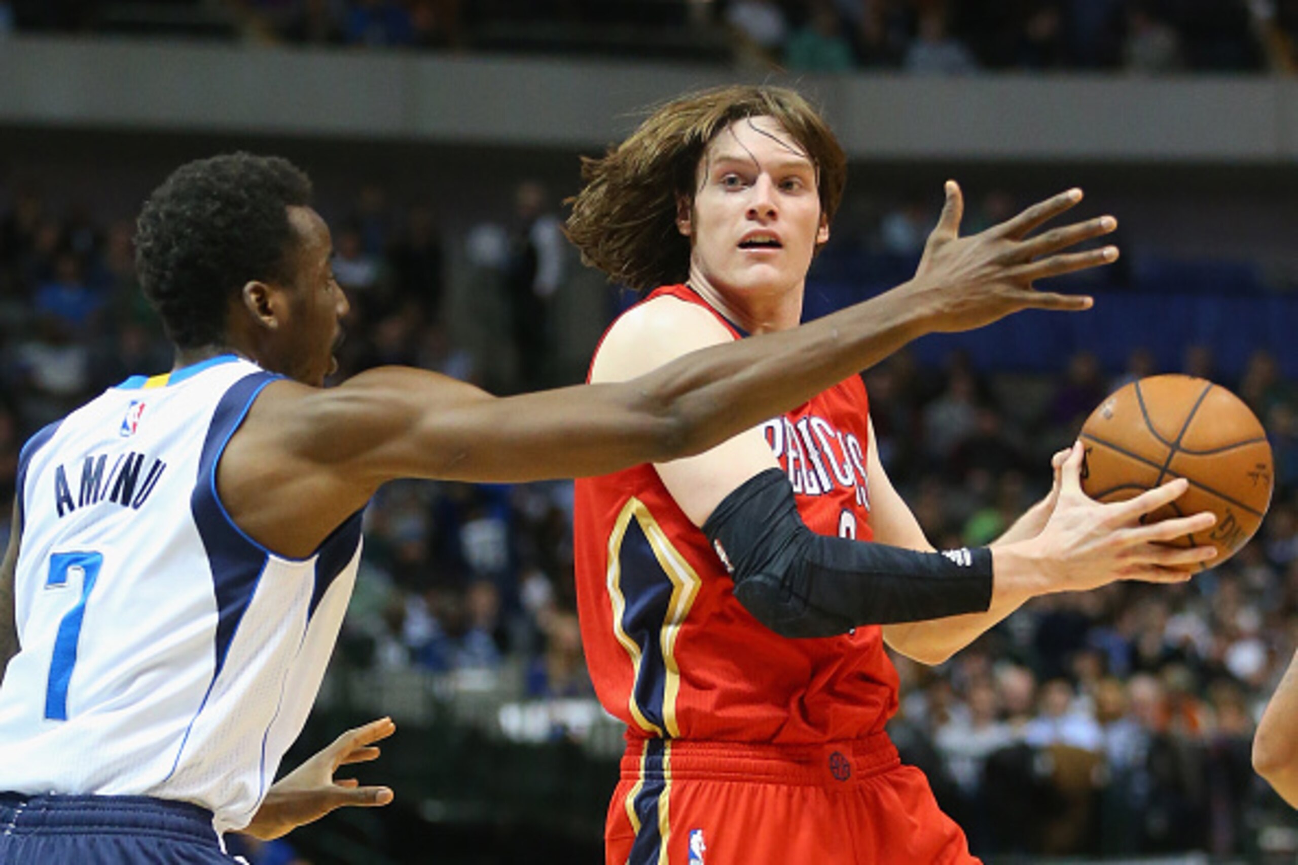DALLAS, TX - MARCH 02: Luke Babbitt #8 of the New Orleans Pelicans dribbles the ball against Al-Farouq Aminu #7 of the Dallas Mavericks at American Airlines Center on March 2, 2015 in Dallas, Texas. NOTE TO USER: User expressly acknowledges and agrees DALLAS, TX - MARCH 02: Luke Babbitt #8 of the New Orleans Pelicans dribbles the ball against Al-Farouq Aminu #7 of the Dallas Mavericks at American Airlines Center on March 2, 2015 in Dallas, Texas. NOTE TO USER: User expressly acknowledges and agrees