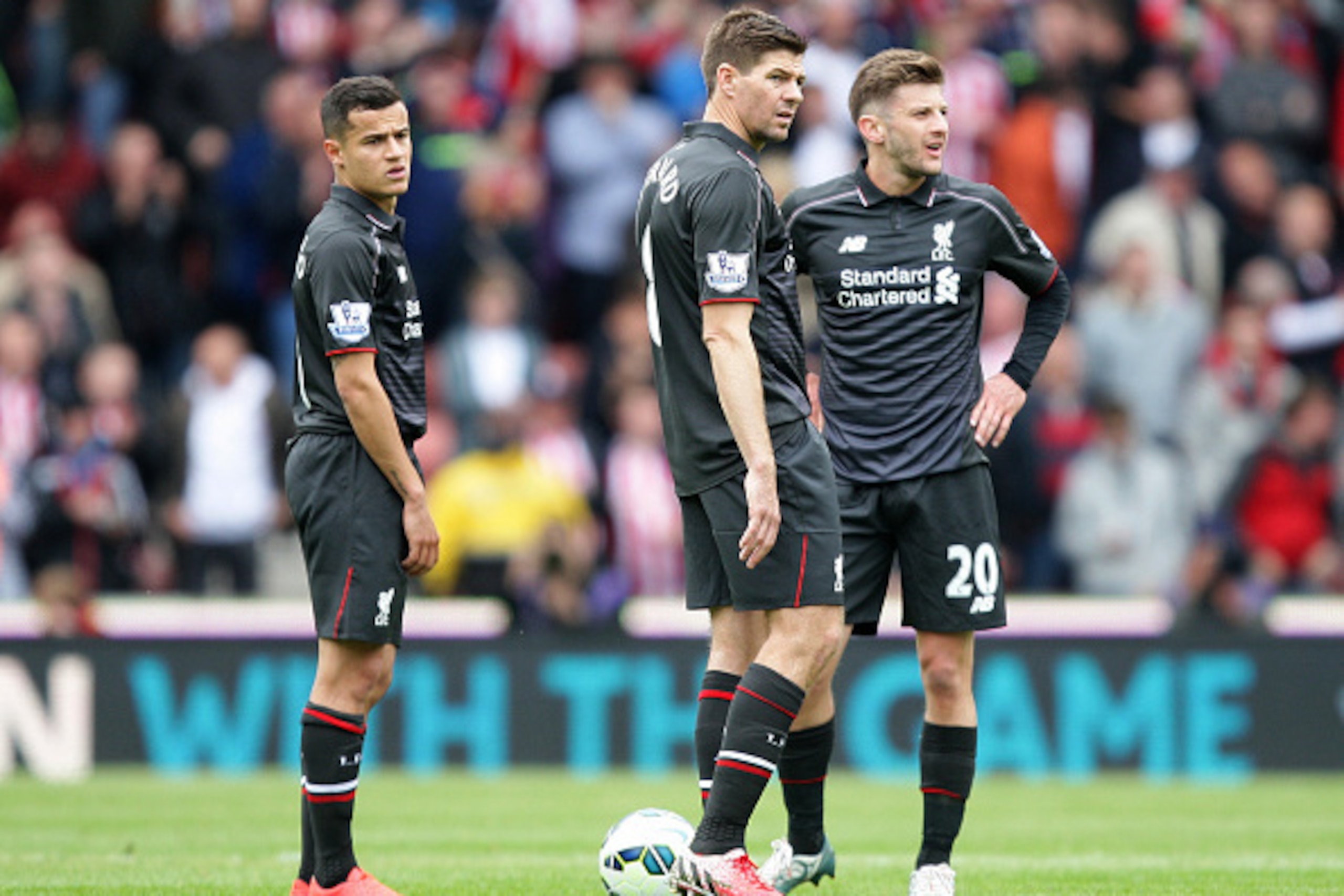 STOKE ON TRENT, ENGLAND - MAY 24: (L to R) Philippe Coutinho, Steven Gerrard and Adam Lallana of Liverpool react during the Barclays Premier League match between Stoke City and Liverpool at Britannia Stadium on May 24, 2015 in Stoke on Trent, England.  (P