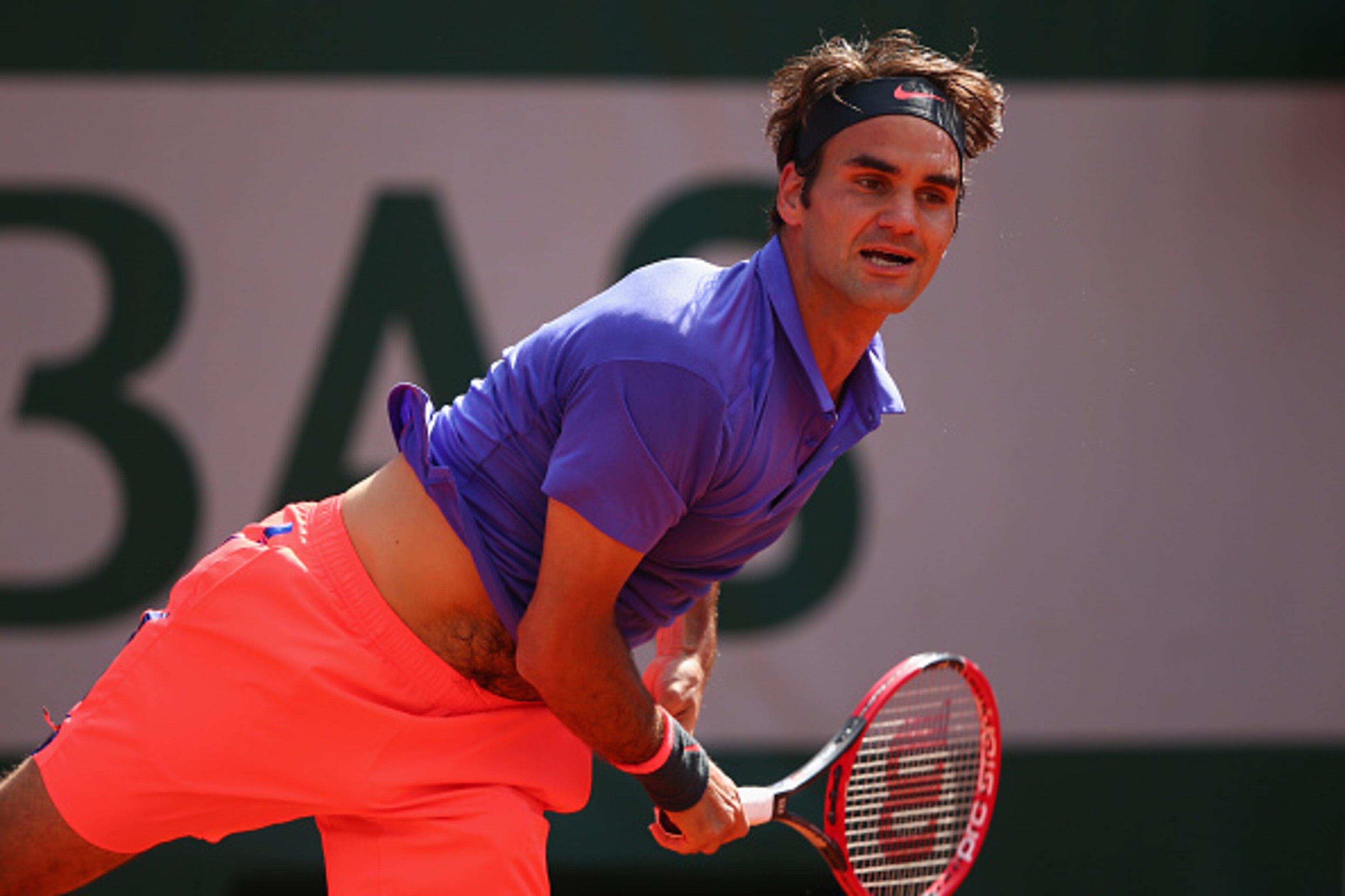 PARIS, FRANCE - JUNE 02:  Roger Federer of Switzerland serves in his Men's quarter final match against Stanislas Wawrinka of Switzerland on day of the 2015 French Open at Roland Garros on June 2, 2015 in Paris, France.  (Photo by Clive Brunskill/Getty Ima