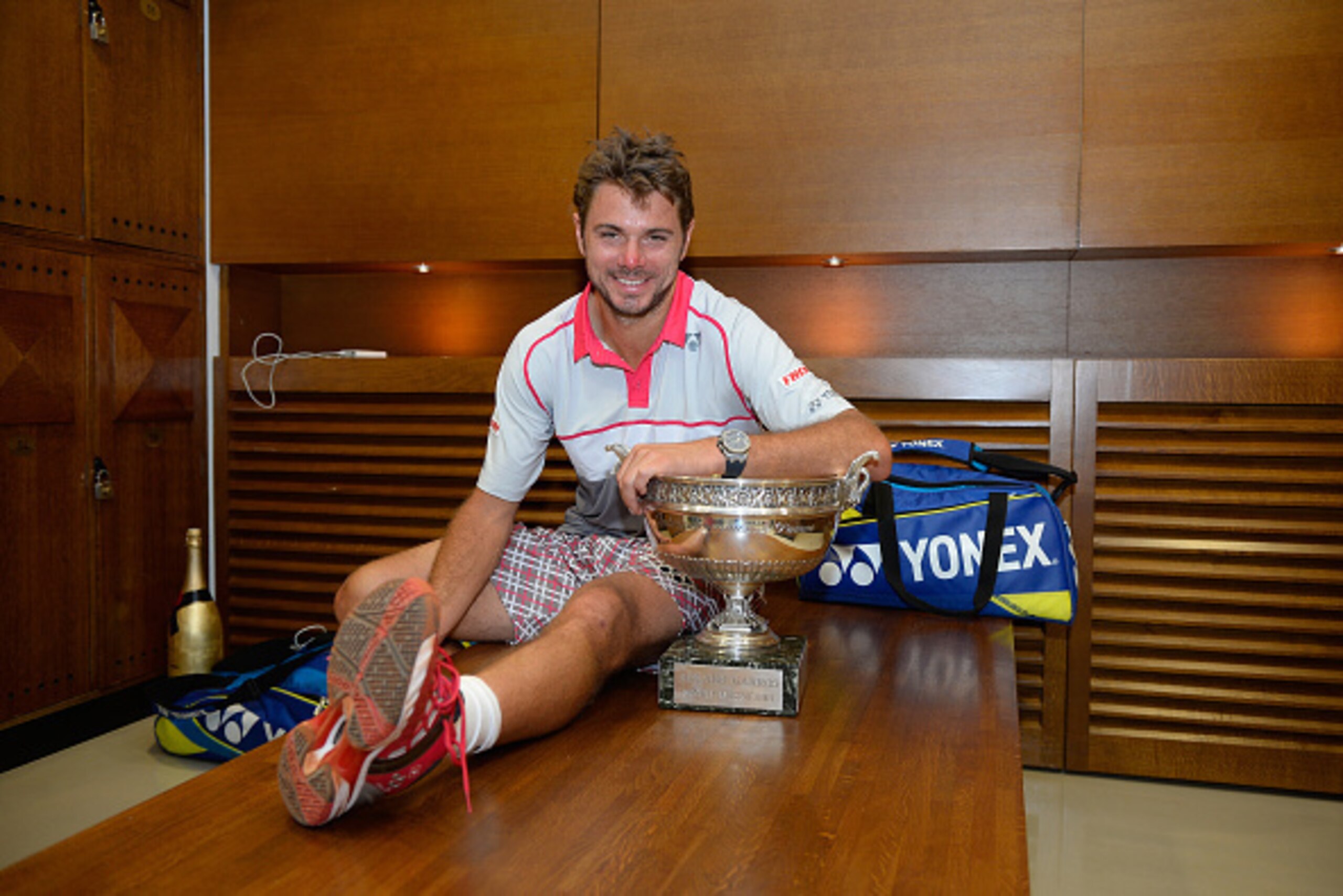 PARIS, FRANCE - JUNE 07: Stanislas Wawrinka of Switzerland poses with the Coupe de Mousquetaires after victory in his changing room after the Men's Singles Final against Novak Djokovic of Serbia on day fifteen of the 2015 French Open at Roland Garros on PARIS, FRANCE - JUNE 07: Stanislas Wawrinka of Switzerland poses with the Coupe de Mousquetaires after victory in his changing room after the Men's Singles Final against Novak Djokovic of Serbia on day fifteen of the 2015 French Open at Roland Garros on