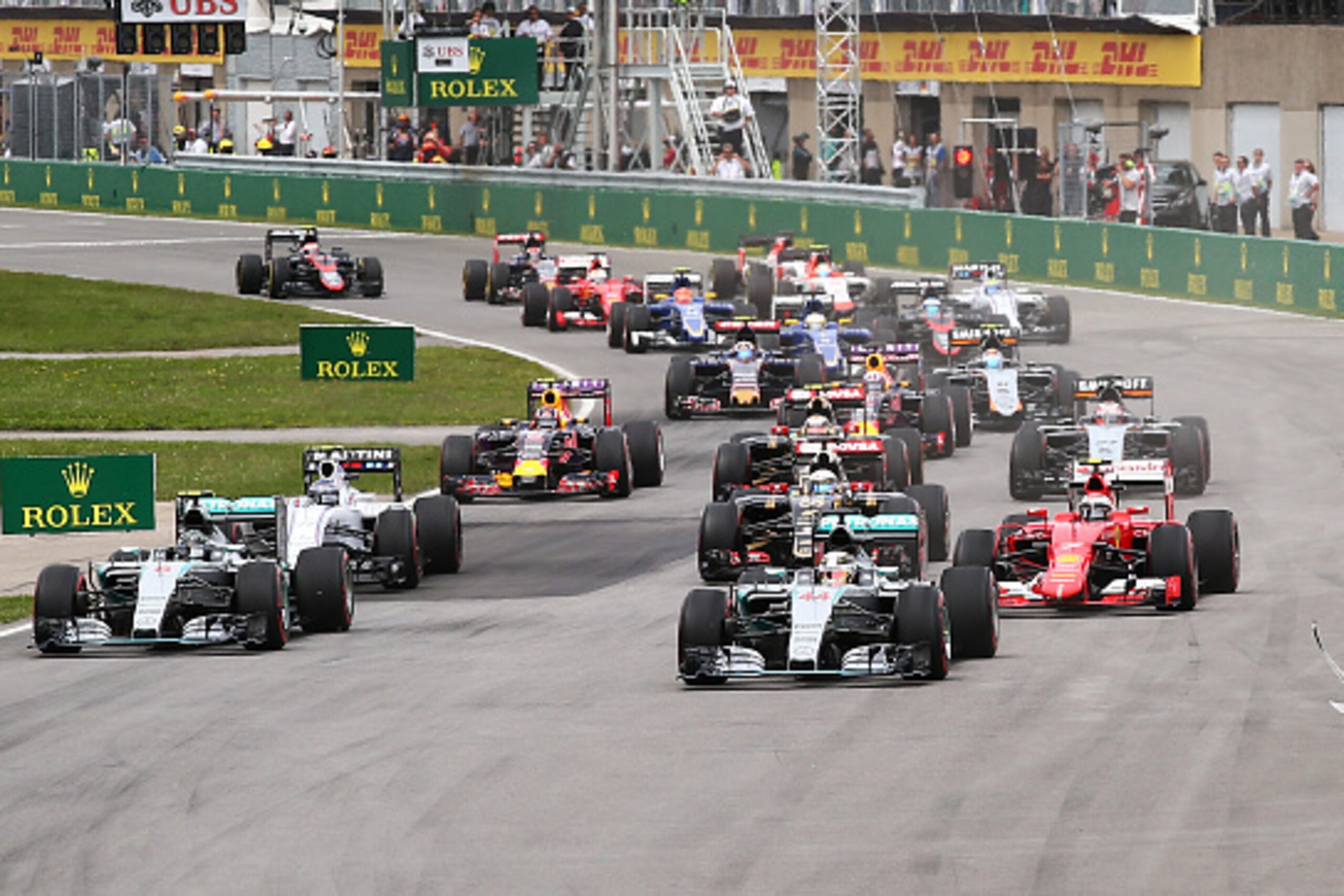 MONTREAL, QC - JUNE 07:  Lewis Hamilton of Great Britain and Mercedes GP leads into the first corner during the Canadian Formula One Grand Prix at Circuit Gilles Villeneuve on June 7, 2015 in Montreal, Canada.  (Photo by Mark Thompson/Getty Images)