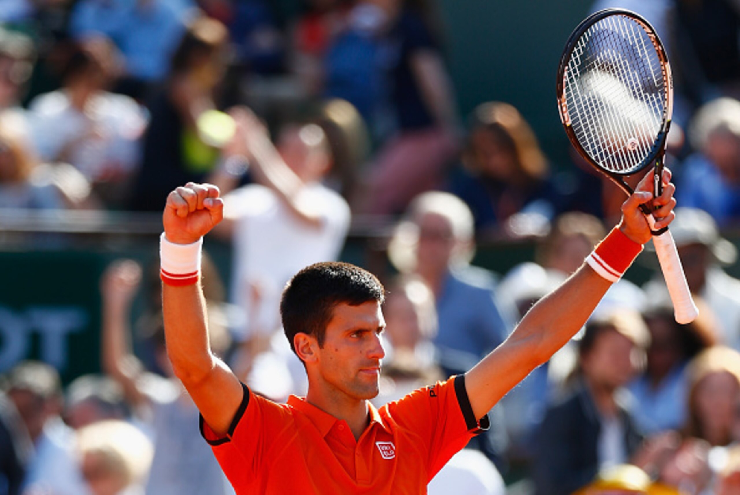 PARIS, FRANCE - JUNE 03:  Novak Djokovic of Serbia celebrates victory in his Men's quarter final match against Rafael Nadal of Spain on day eleven of the 2015 French Open at Roland Garros on June 3, 2015 in Paris, France.  (Photo by Julian Finney/Getty Im