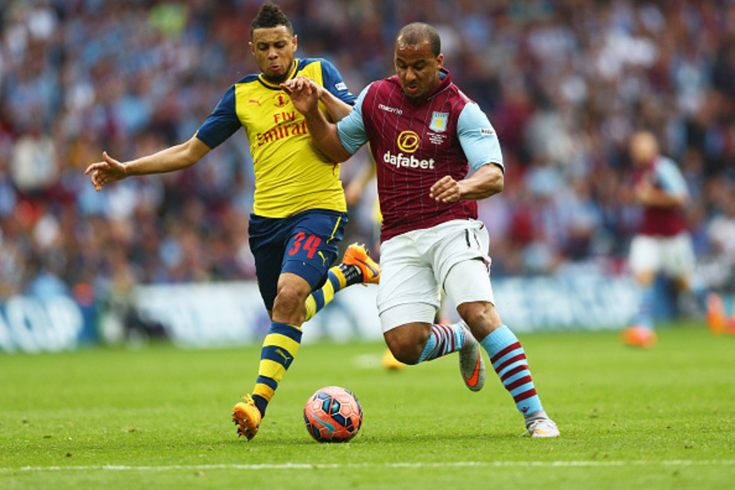 LONDON, ENGLAND - MAY 30:  Gabriel Agbonlahor of Aston Villa and Francis Coquelin of Arsenal battle for the ball  during the FA Cup Final between Aston Villa and Arsenal at Wembley Stadium on May 30, 2015 in London, England.  (Photo by Paul Gilham/Getty I