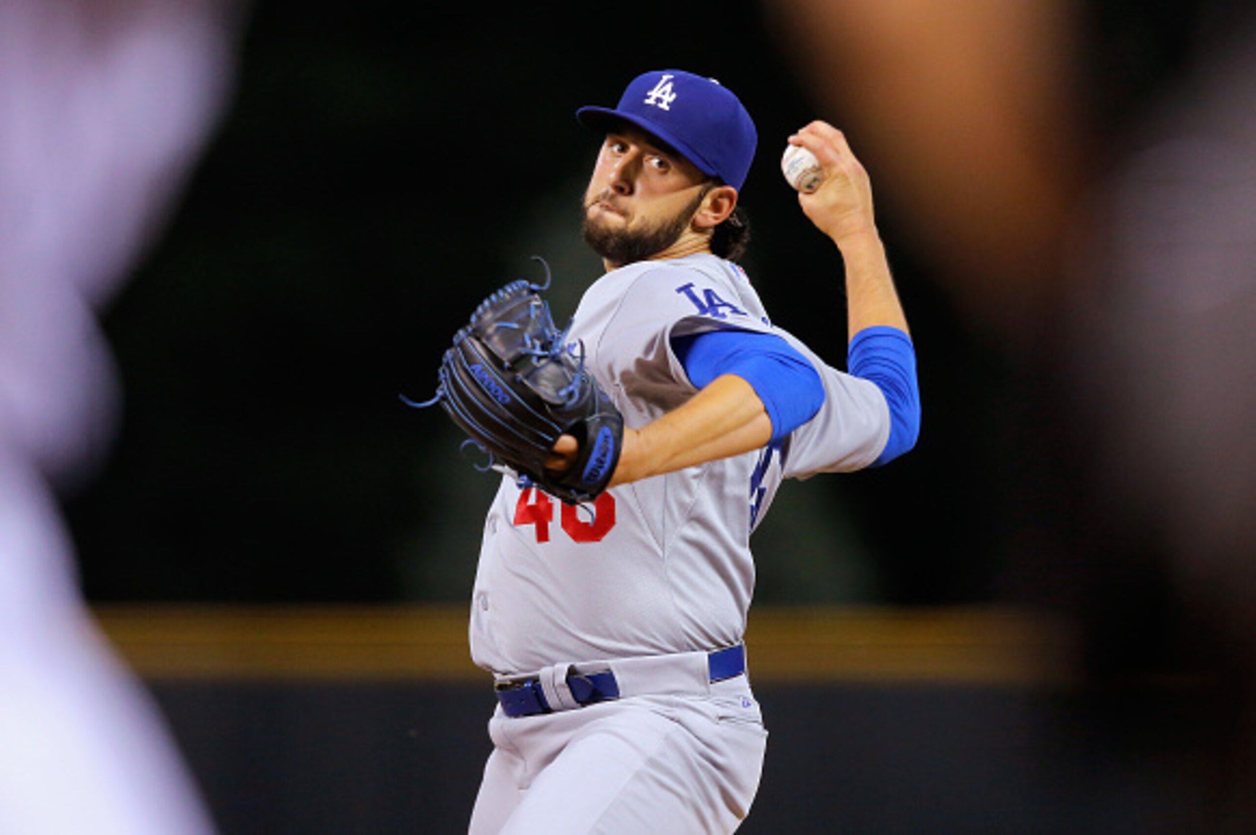 DENVER, CO - JUNE 03:  Starting pitcher Mike Bolsinger #46 of the Los Angeles Dodgers delivers against the Colorado Rockies at Coors Field on June 3, 2015 in Denver, Colorado.  (Photo by Doug Pensinger/Getty Images)