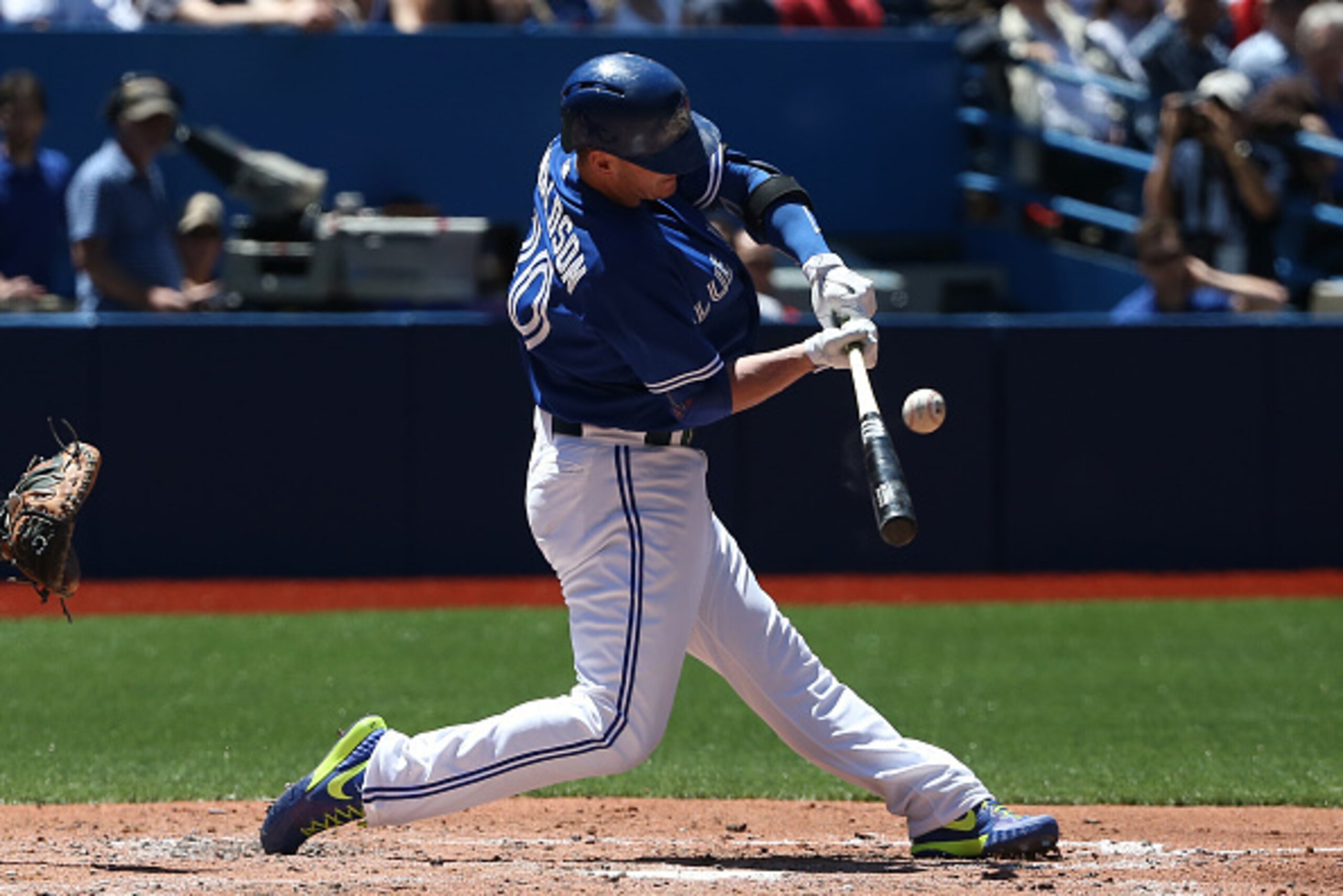 TORONTO, CANADA - JUNE 6: Josh Donaldson #20 of the Toronto Blue Jays hits an RBI sacrifice fly in the second inning during MLB game action against the Houston Astros on June 6, 2015 at Rogers Centre in Toronto, Ontario, Canada. (Photo by Tom Szczerbowski