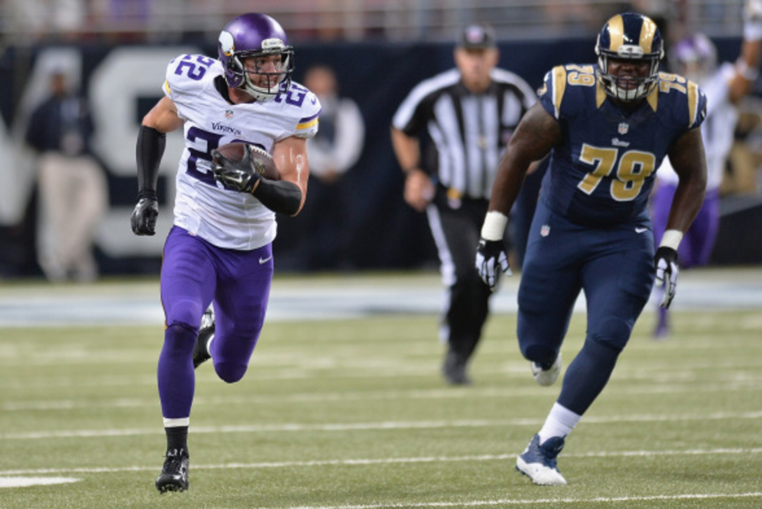 ST. LOUIS, MO - SEPTEMBER 7:  Harrison Smith #22 of the Minnesota Vikings returns and interception for a touchdown in the fourth quarter at the Edward Jones Dome on September 7, 2014 in St. Louis, Missouri. The Vikings defeated the Rams 34-6.  (Photo by M