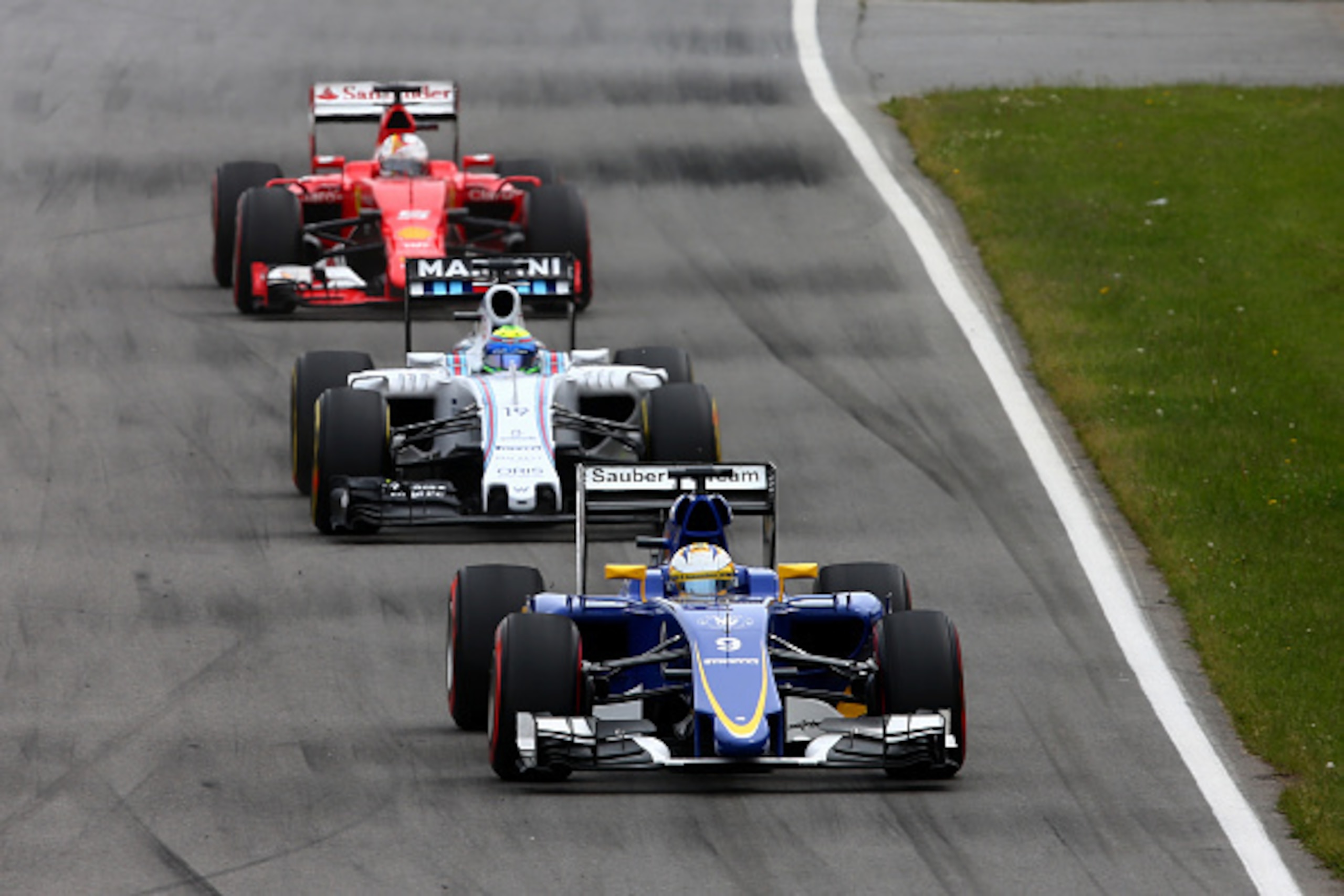 MONTREAL, QC - JUNE 07: Marcus Ericsson of Sweden and Sauber F1 is pursued by Felipe Massa of Brazil and Williams and Sebastian Vettel of Germany and Ferrari during the Canadian Formula One Grand Prix at Circuit Gilles Villeneuve on June 7, 2015 in Montr MONTREAL, QC - JUNE 07: Marcus Ericsson of Sweden and Sauber F1 is pursued by Felipe Massa of Brazil and Williams and Sebastian Vettel of Germany and Ferrari during the Canadian Formula One Grand Prix at Circuit Gilles Villeneuve on June 7, 2015 in Montr