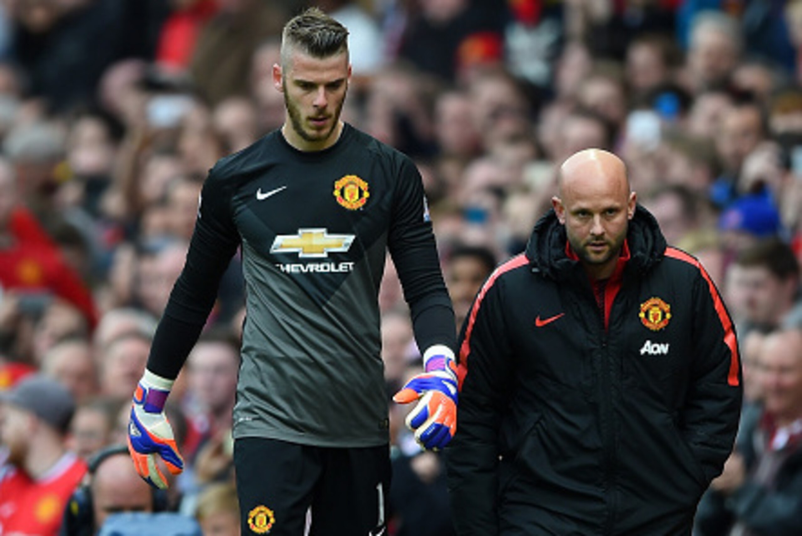 MANCHESTER, ENGLAND - MAY 17:  David De Gea of Manchester United walks along the touchline as he is substituted during the Barclays Premier League match between Manchester United and Arsenal at Old Trafford on May 17, 2015 in Manchester, England.  (Photo 