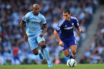 MANCHESTER, ENGLAND - SEPTEMBER 21:  Eden Hazard of Chelsea competes with Fernandinho of Manchester City during the Barclays Premier League match between Manchester City and Chelsea at the Etihad Stadium on September 21, 2014 in Manchester, England.  (Pho