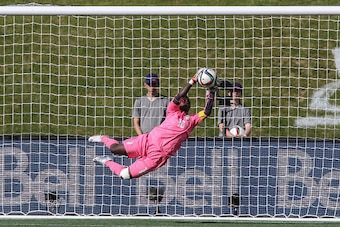 OTTAWA, ON - JUNE 7: Dominique Thiamale #16 of Cote d'Ivoire makes a diving save during the FIFA Women's World Cup Canada 2015 Group B match between Germany and Cote d'Ivoire at Lansdowne Stadium on June 7, 2015 in Ottawa, Canada.  (Photo by Andre Ringuet