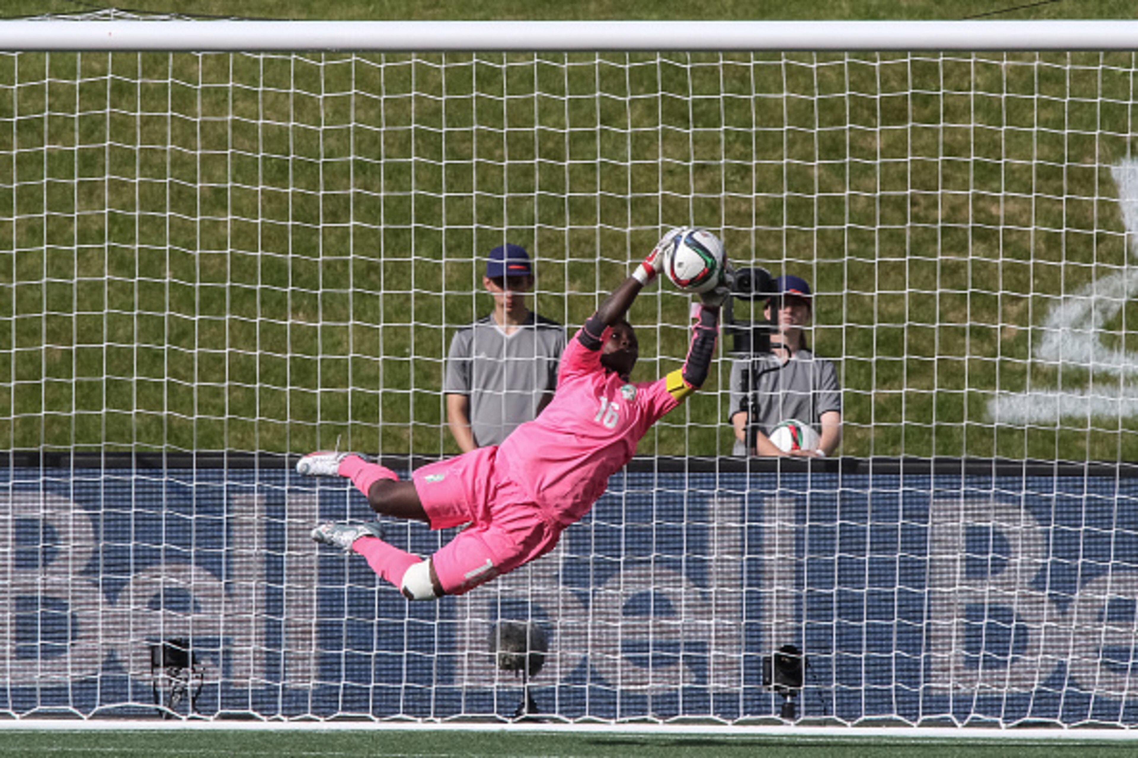 OTTAWA, ON - JUNE 7: Dominique Thiamale #16 of Cote d'Ivoire makes a diving save during the FIFA Women's World Cup Canada 2015 Group B match between Germany and Cote d'Ivoire at Lansdowne Stadium on June 7, 2015 in Ottawa, Canada.  (Photo by Andre Ringuet
