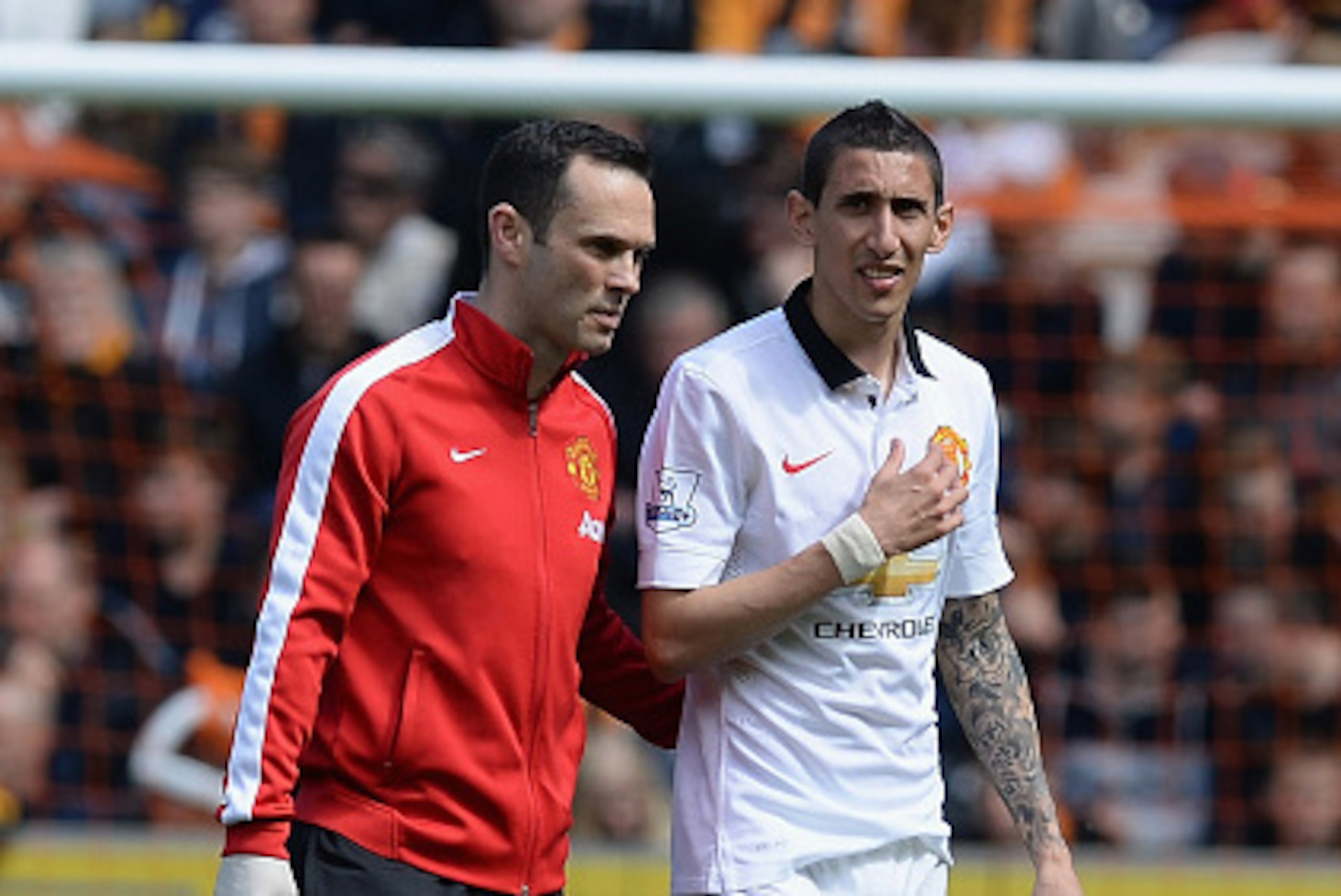HULL, ENGLAND - MAY 24: Angel di Maria of Manchester United receives medical treatment during the Barclays Premier League match between Hull City and Manchester United at KC Stadium on May 24, 2015 in Hull, England.  (Photo by Nigel Roddis/Getty Images)