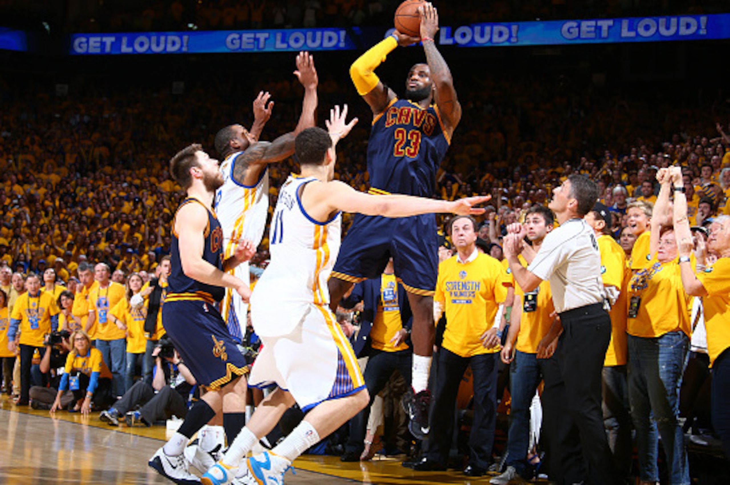 OAKLAND, CA - JUNE 7: LeBron James #23 of the Cleveland Cavaliers shoots over Andre Iguodala #9 of the Golden State Warriors and Klay Thompson #11 of the Golden State Warriors during Game Two of the 2015 NBA Finals on June 7, 2015 at Oracle Arena in Oakla